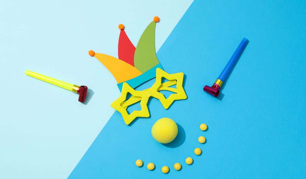 1024x600, playful jester face, colorful party props, SD Desktop Wallpaper