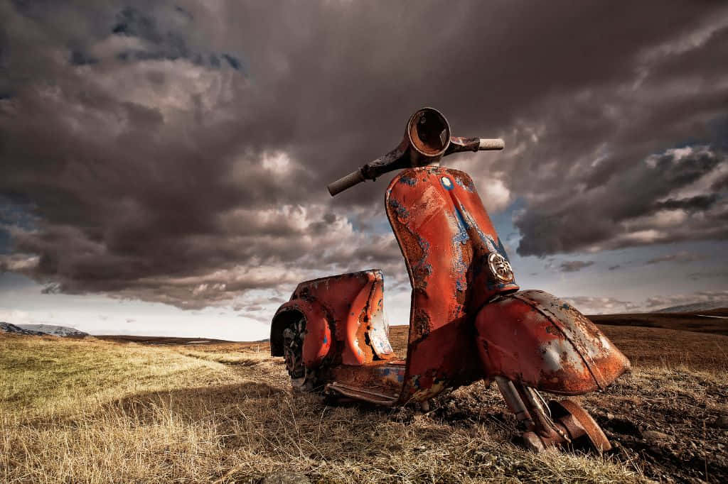 rusted red scooter, barren field, dramatic cloudy sky, SD Desktop Wallpaper