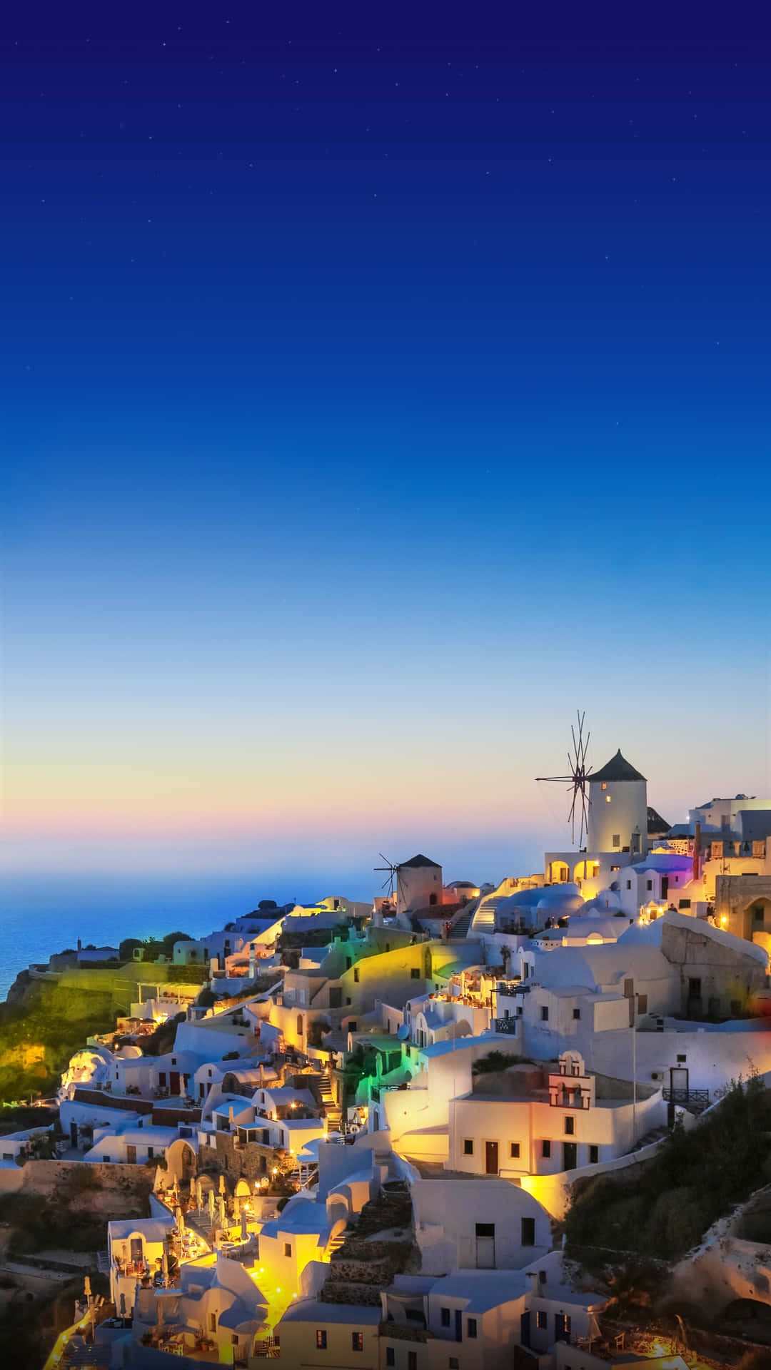 white cliffside village, warm lights, deep blue twilight sky, Full HD Phone Wallpaper