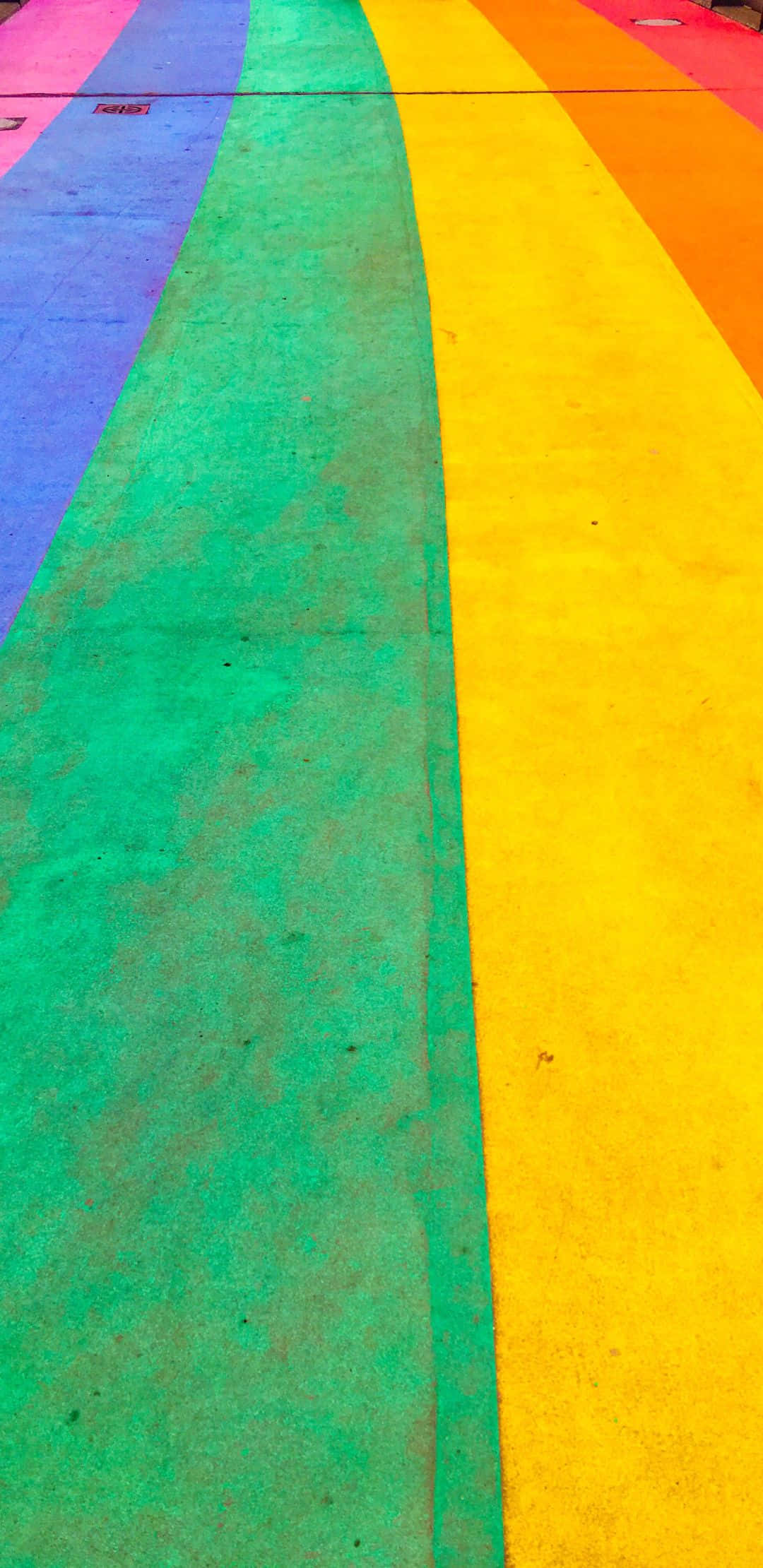 vibrant rainbow-colored paved path, bold stripes of purple blue green yellow and orange, public space, Full HD Phone Wallpaper