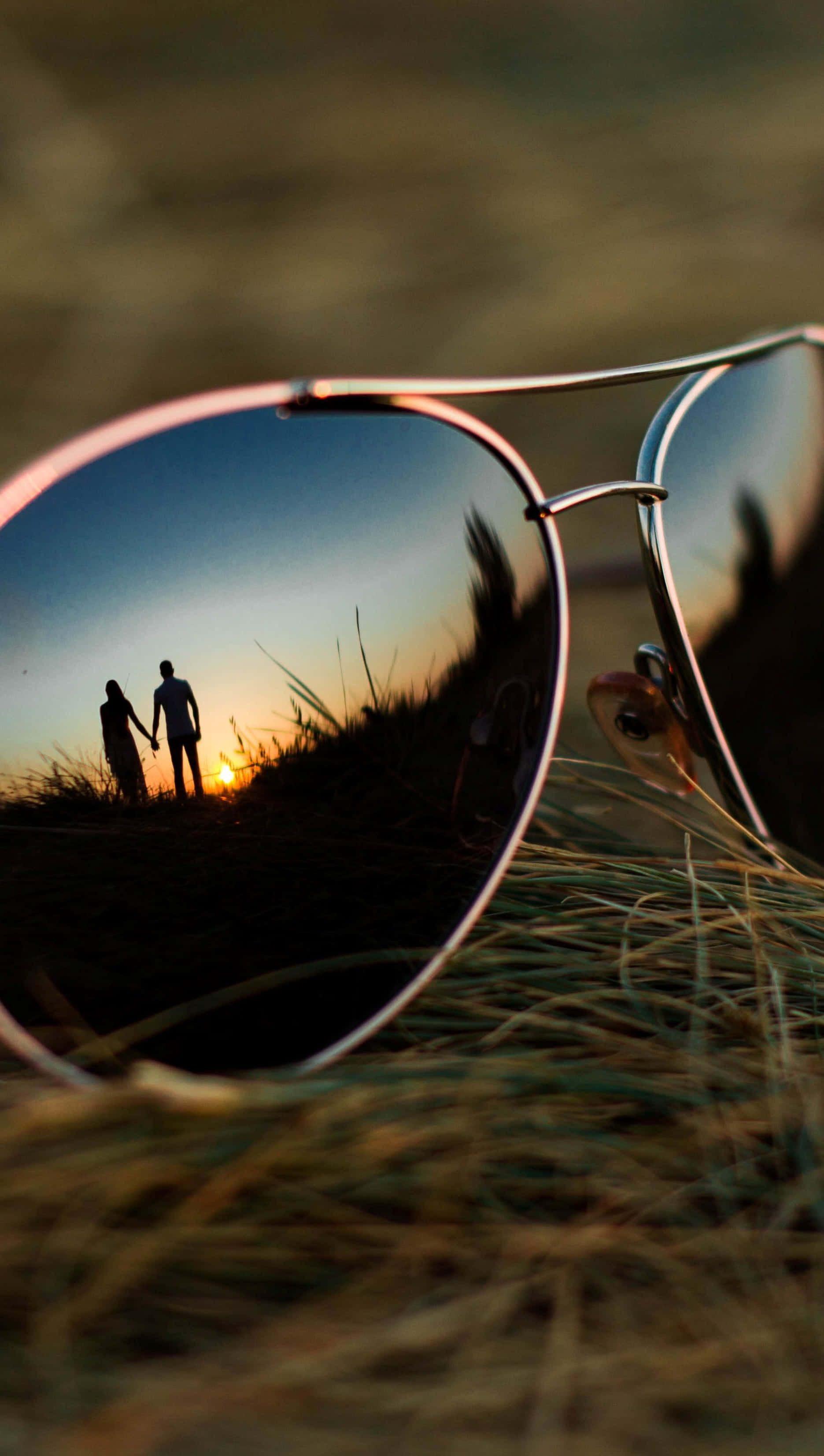 aviator sunglasses, grass, couple holding hands, 2K Phone Wallpaper