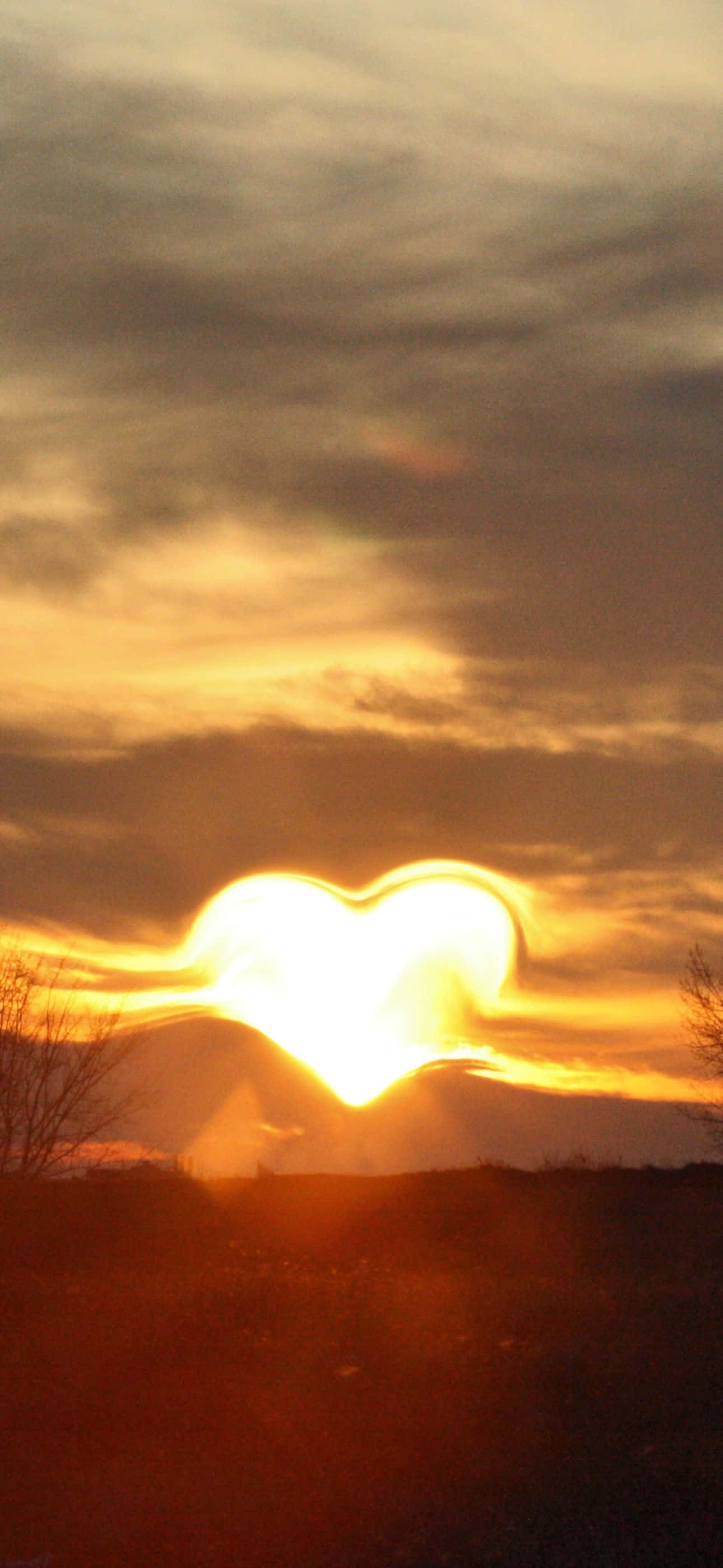 heart-shaped sun, sunset, darkened landscape, 2K Phone Wallpaper