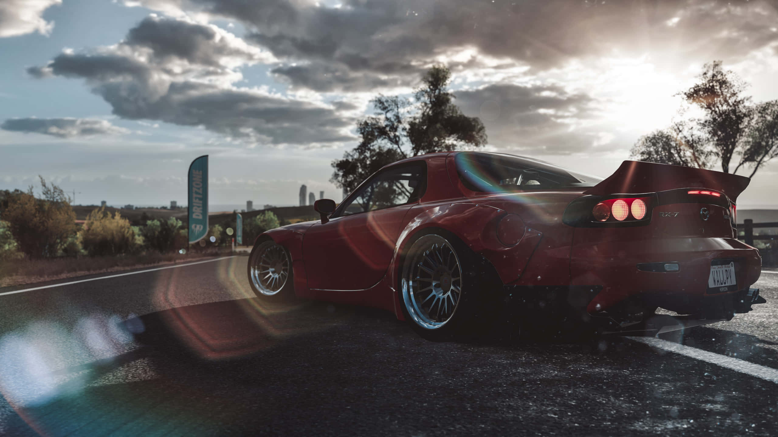red Mazda RX-7, wet road, dramatic cloudy sky, 2K Desktop Wallpaper