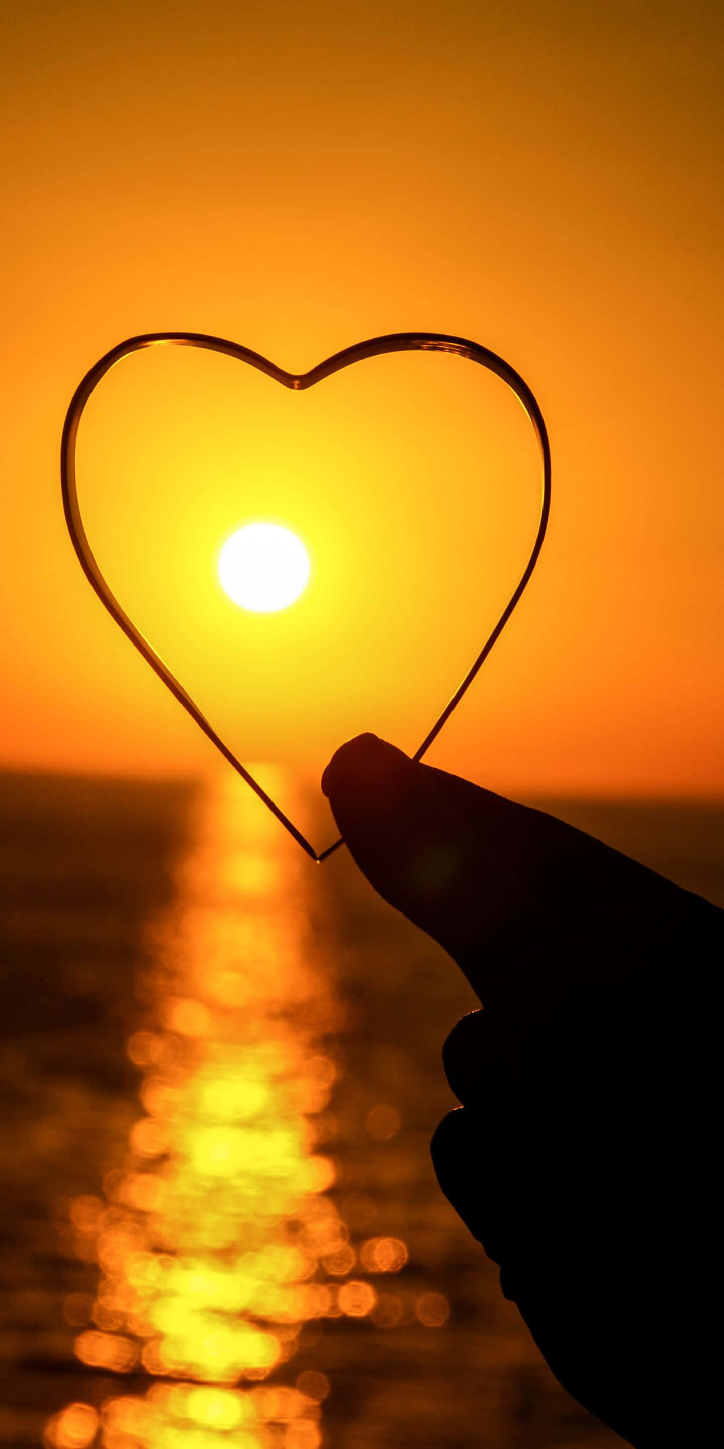 1440x2880, heart-shaped frame, glowing sunset, 2K Phone Wallpaper