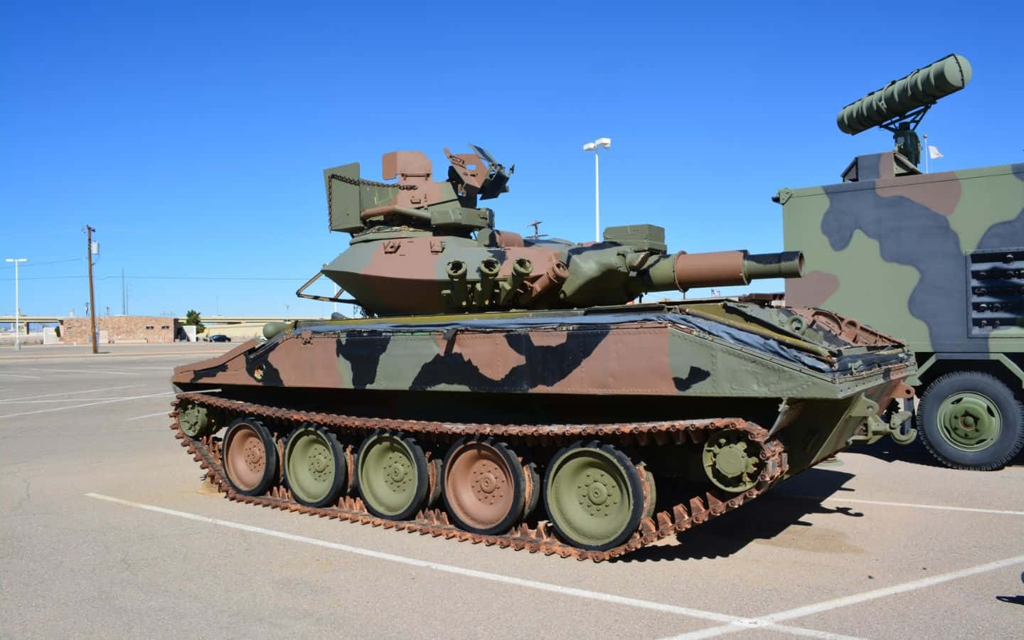 camouflaged military tank, rusted tracks, sunlit asphalt lot, HD Desktop Wallpaper
