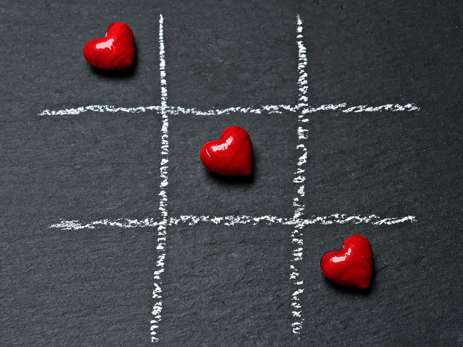 glossy red heart-shaped objects, chalk-drawn tic tac toe grid, dark slate, HD Desktop Wallpaper