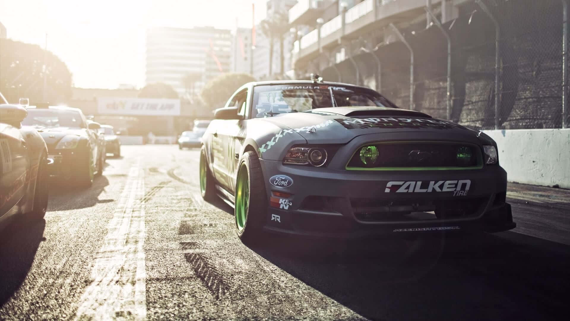 black drift car, neon green accents, sunlit urban track, Full HD Desktop Wallpaper