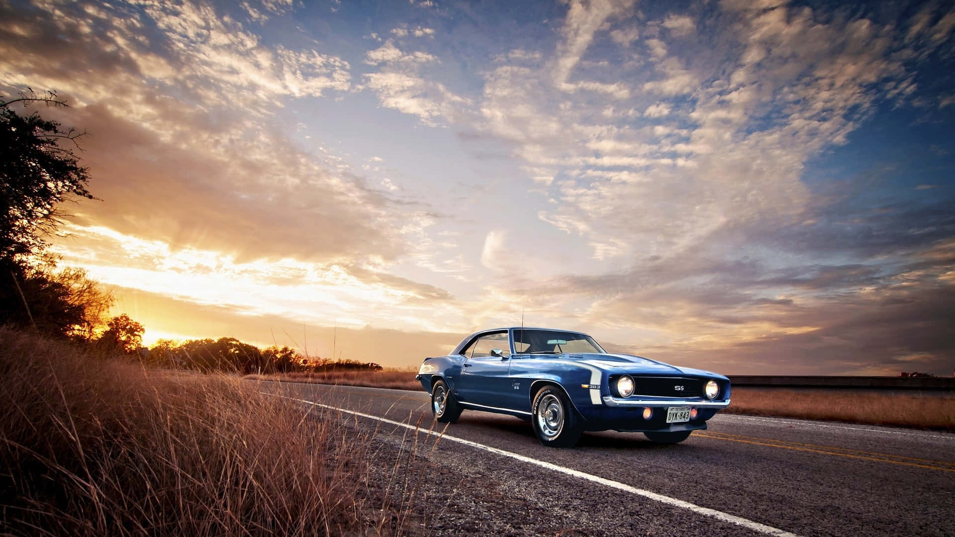 classic blue muscle car, rural road, dramatic sunset sky, Full HD Desktop Wallpaper