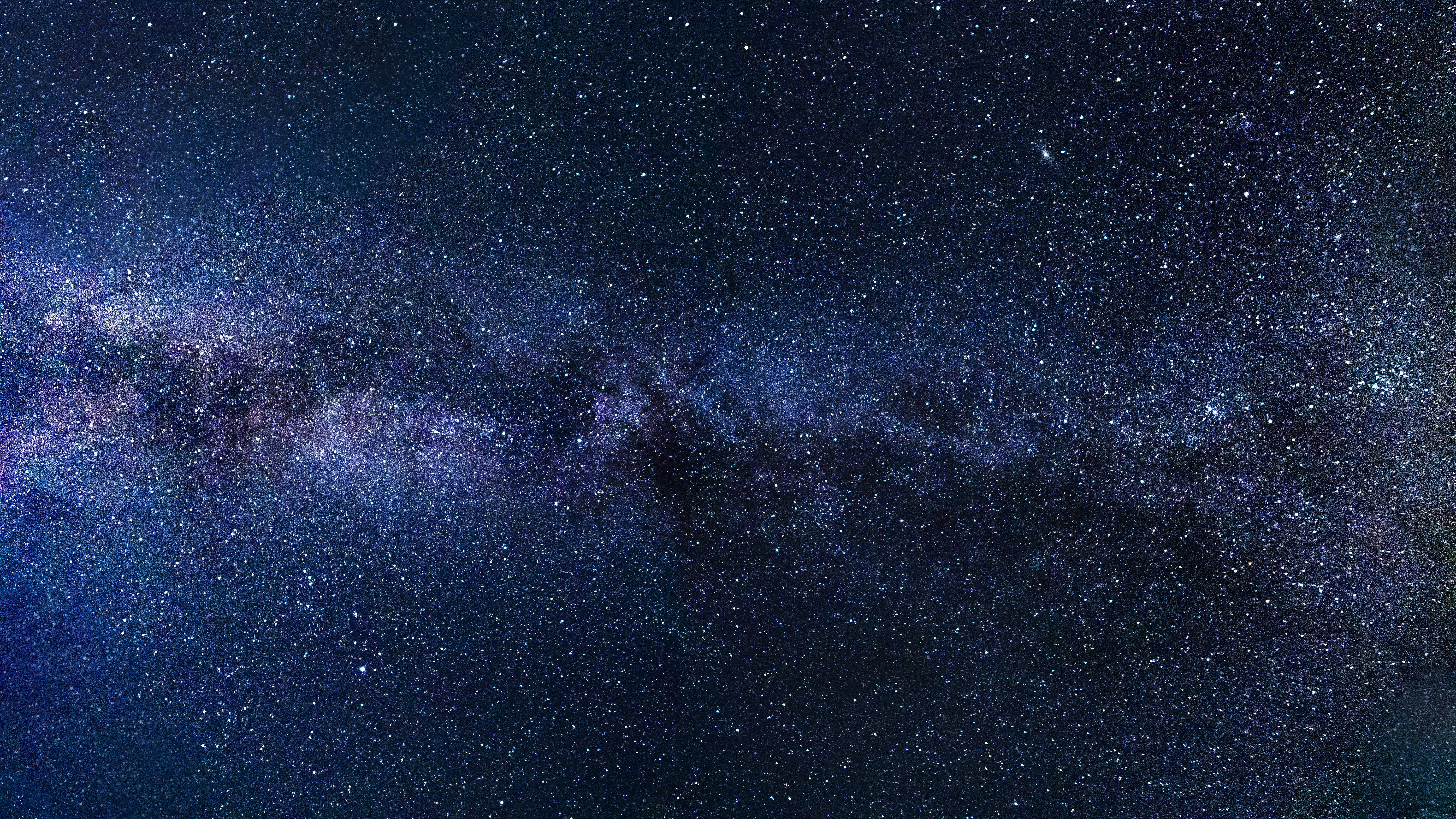 Milky Way galaxy, purple and blue hues, star-filled night sky, 5K Desktop Wallpaper