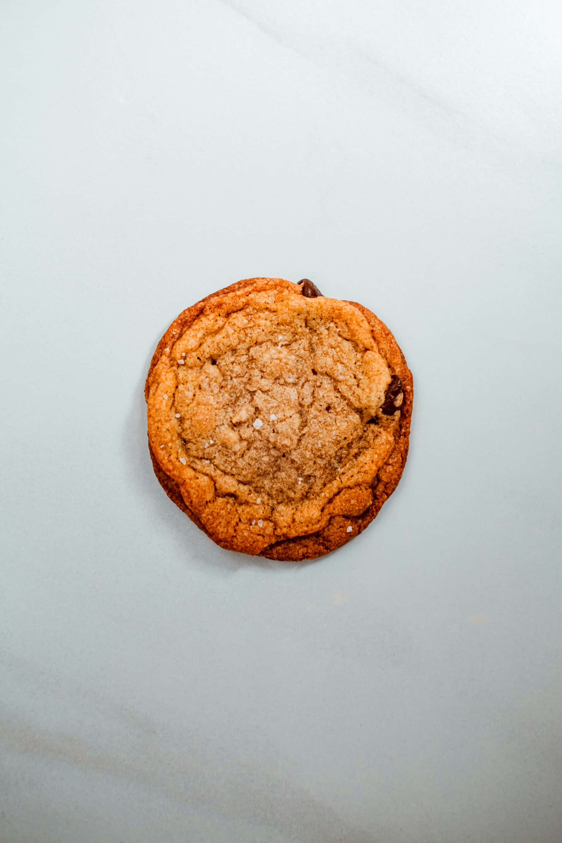 single chocolate chip cookie, golden brown, coarse sugar crystals, 2K Phone Wallpaper