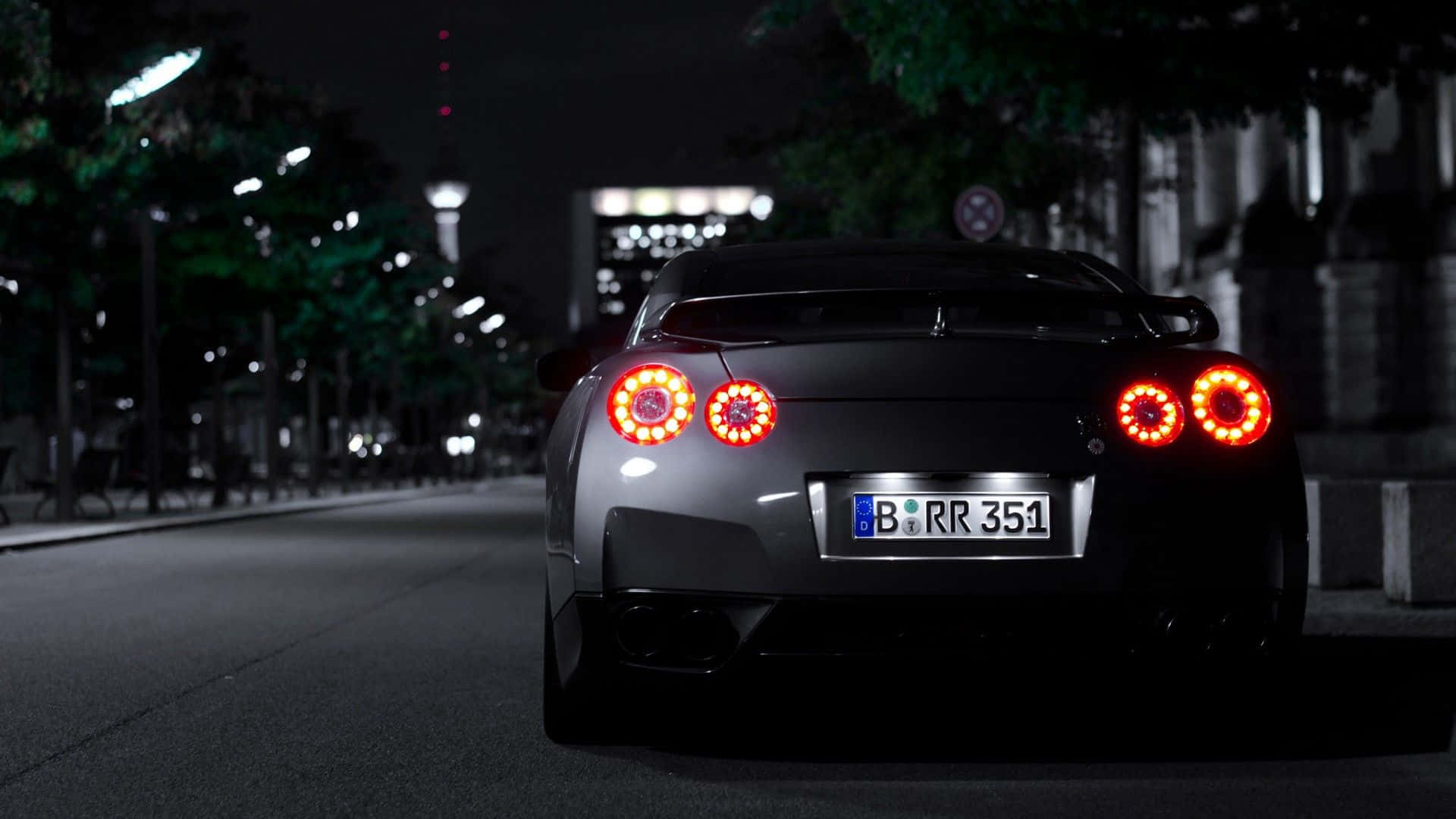 1920x1080 HD Car, sleek black sports car, glowing red circular taillights, Full HD Desktop Wallpaper