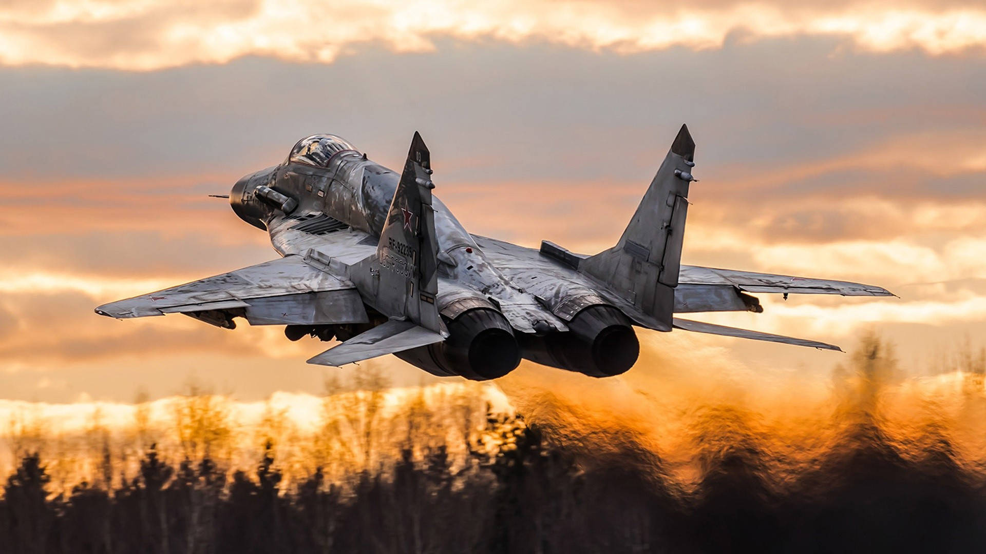 gray fighter jet, fiery sunset sky, silhouetted forest, Full HD Desktop Wallpaper