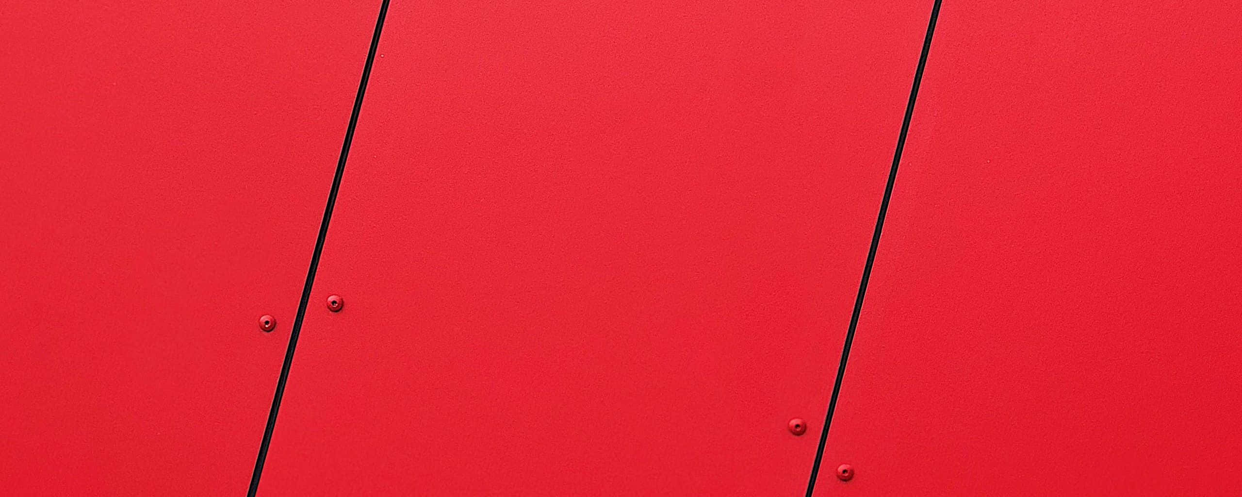 Red Ultra Wide HD, vibrant red surface, bold black diagonal lines, 2K Desktop Wallpaper