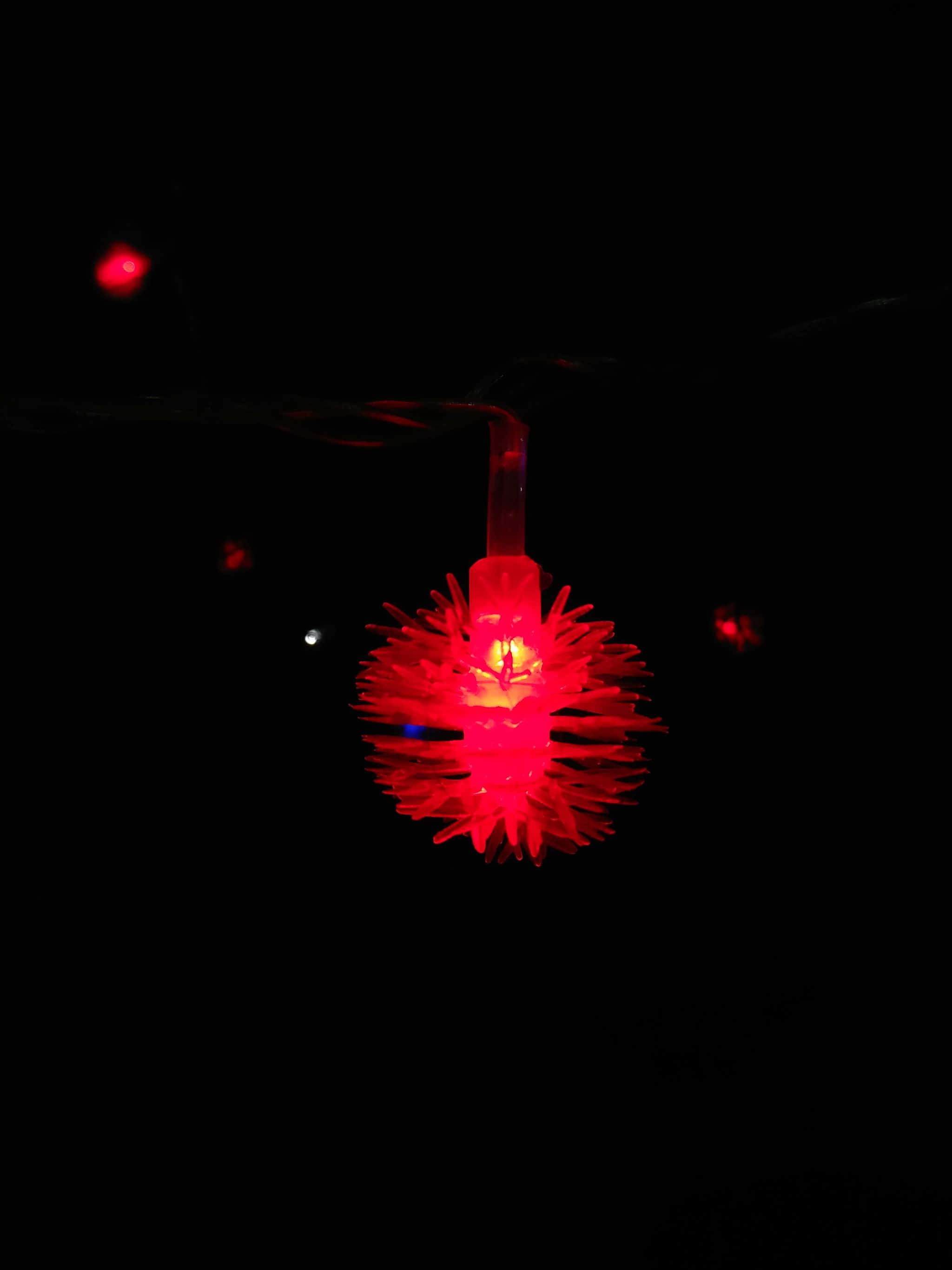 2048x2732, glowing red spiky bulb, pitch black background, 2K Phone Wallpaper
