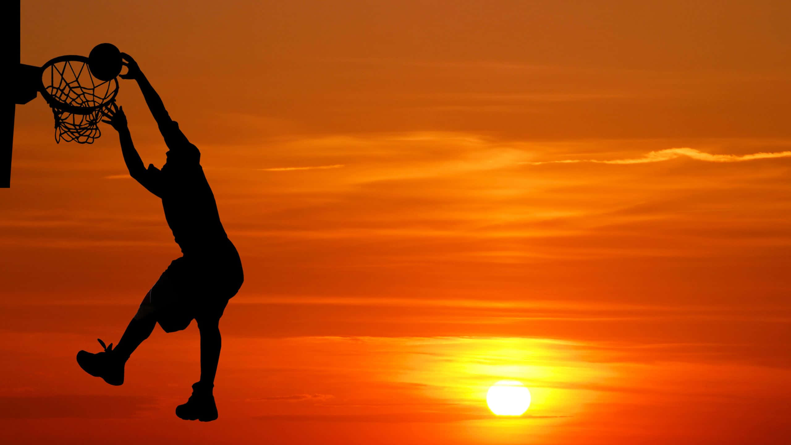 basketball player, mid-dunk, fiery orange sunset sky, 2K Desktop Wallpaper