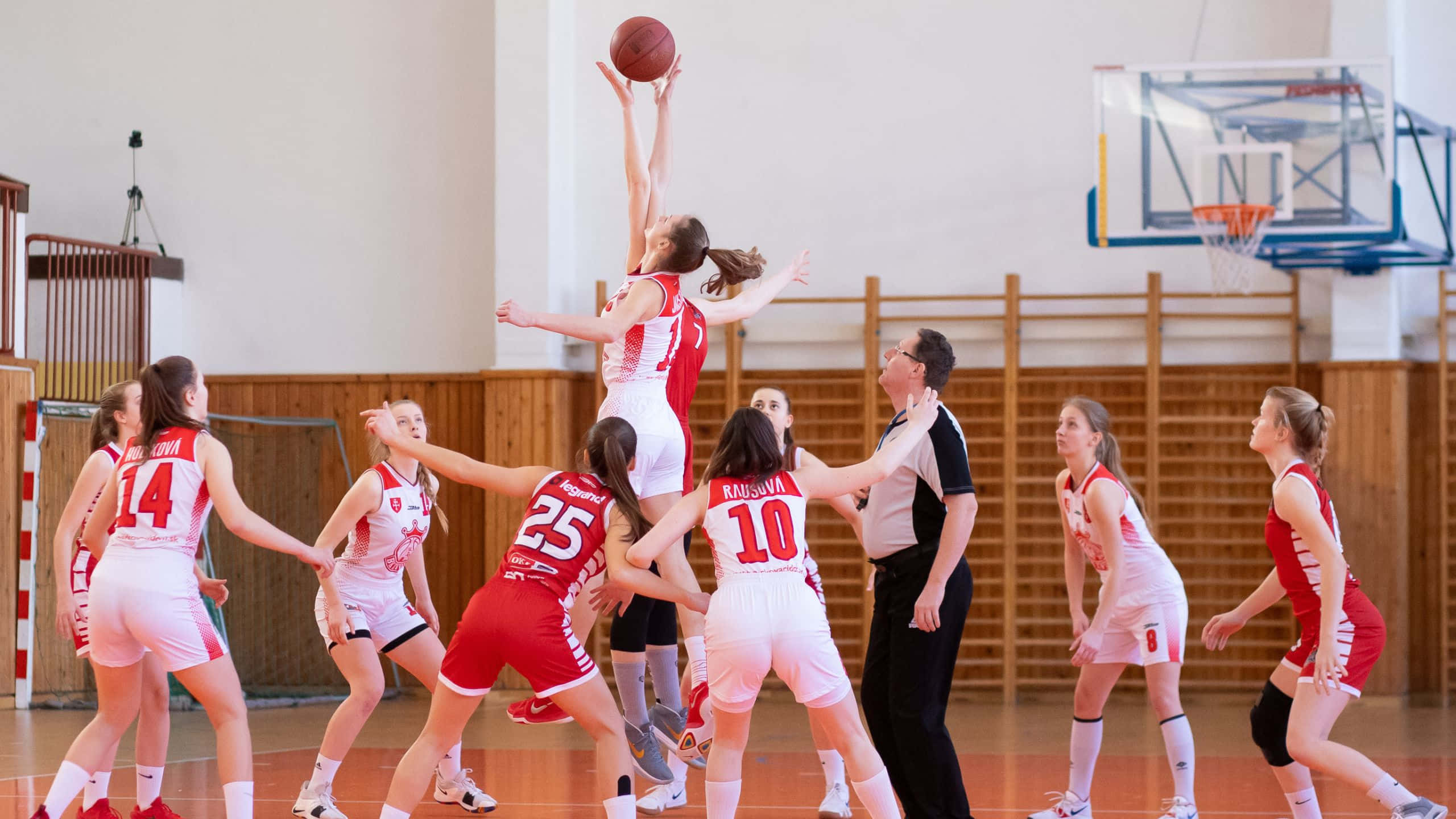 female basketball player, red and white jersey, bright gym lights, 2K Desktop Wallpaper