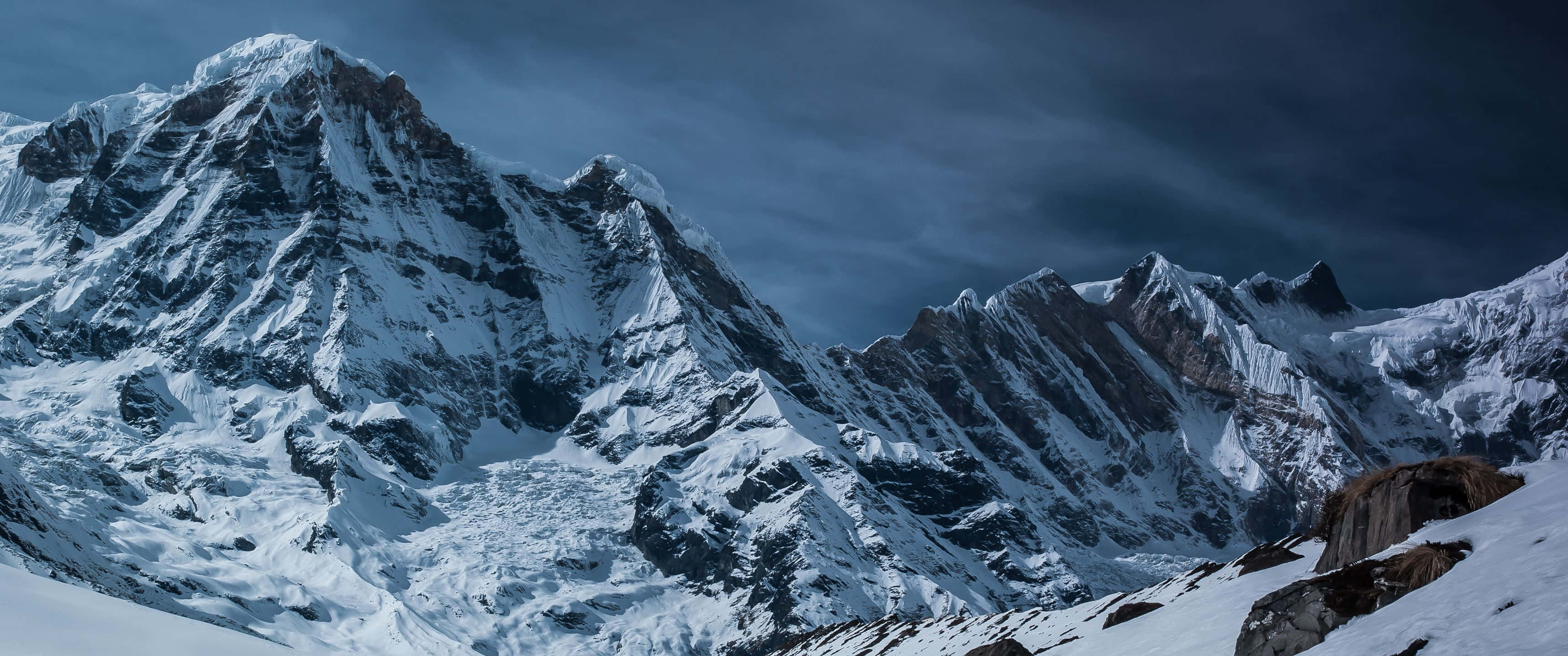 3440x1440 HD, snow-covered mountain range, moody dark sky, 2K Desktop Wallpaper