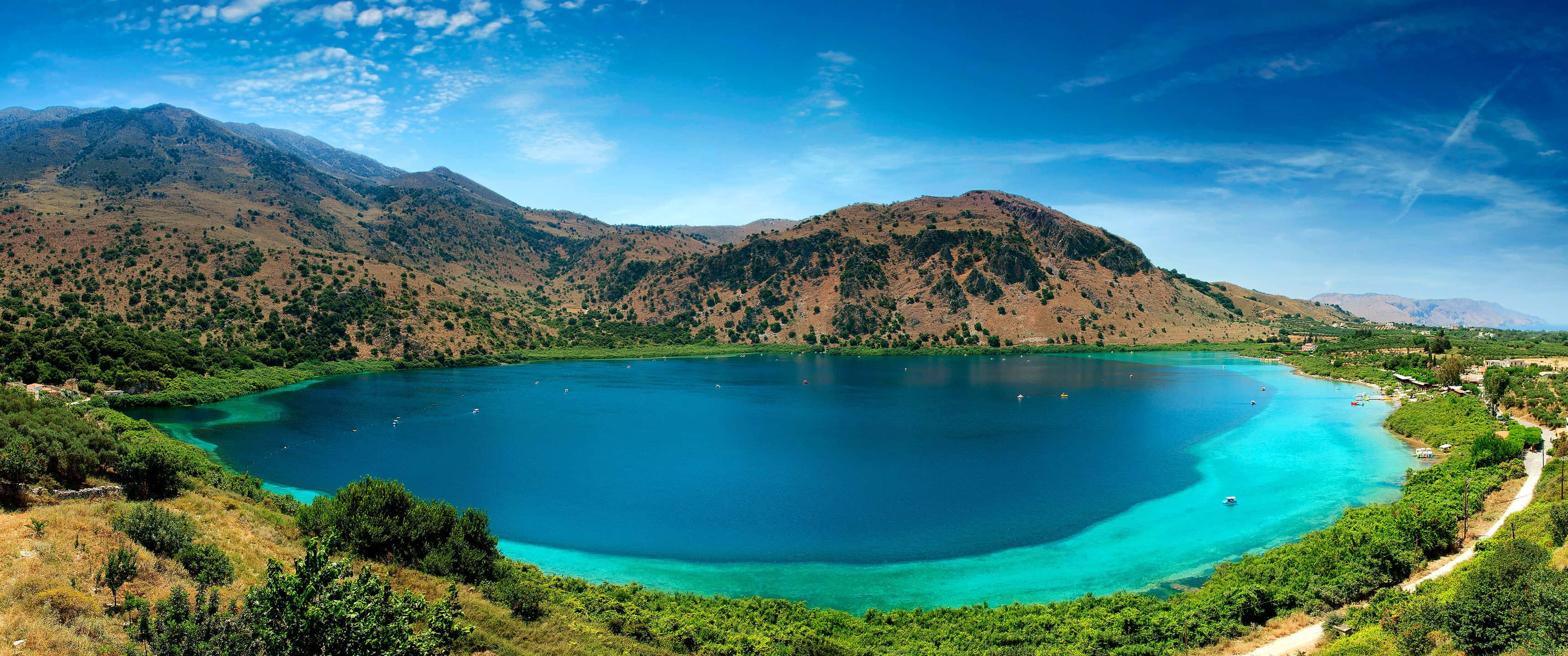 3440x1440 HD, turquoise lake, rugged brown mountains, 2K Desktop Wallpaper