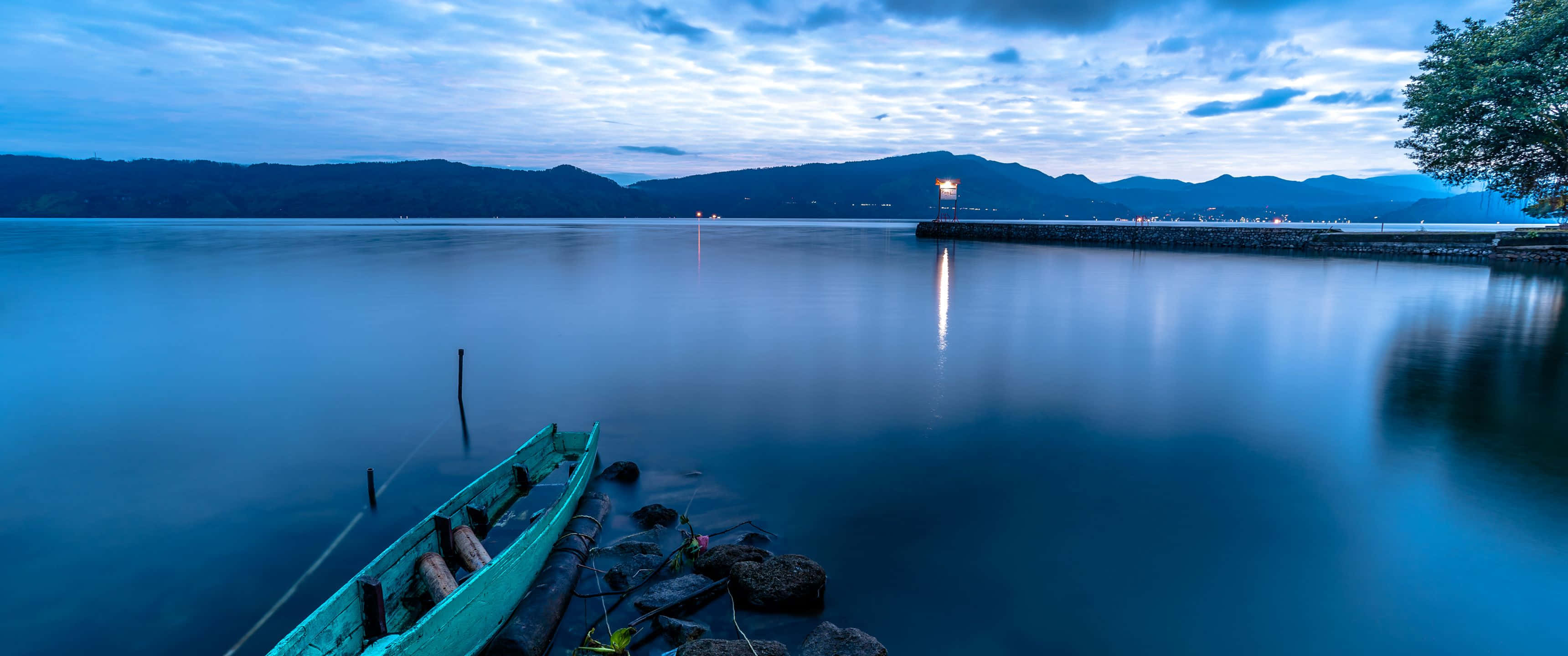 3440x1440, teal boat, rocky shore, 2K Desktop Wallpaper