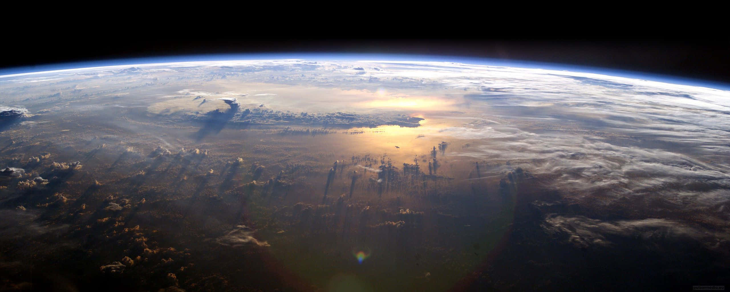 Earth, sunrise, golden light, 2K Desktop Wallpaper