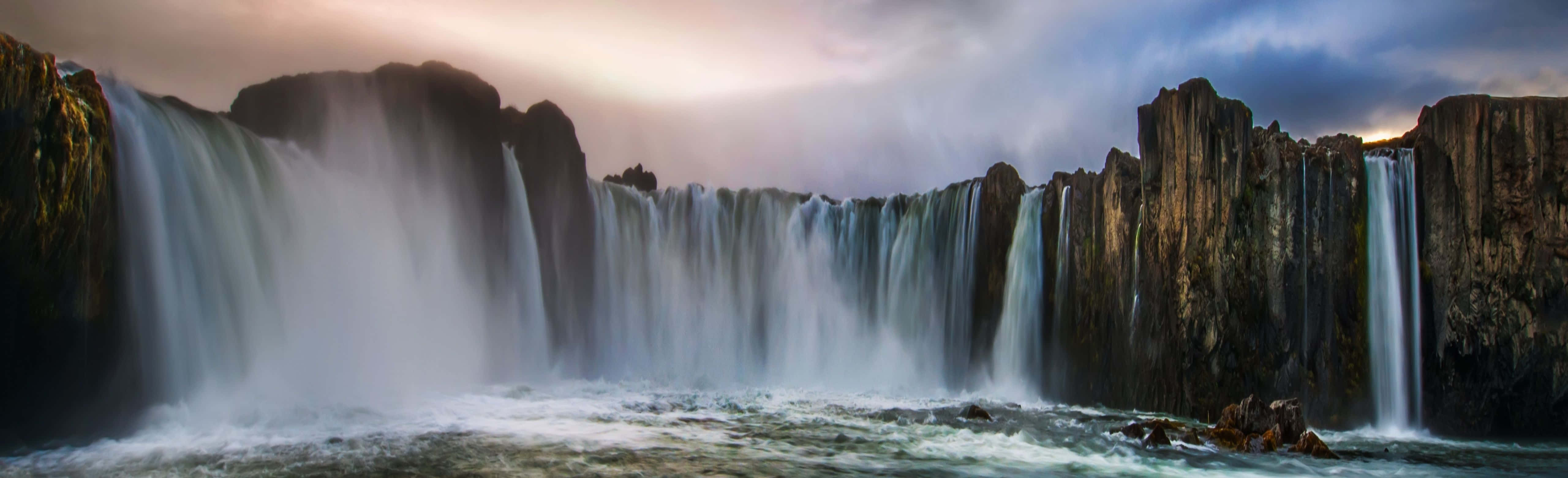 waterfall, dark basalt cliffs, moody twilight sky, 5K Desktop Wallpaper