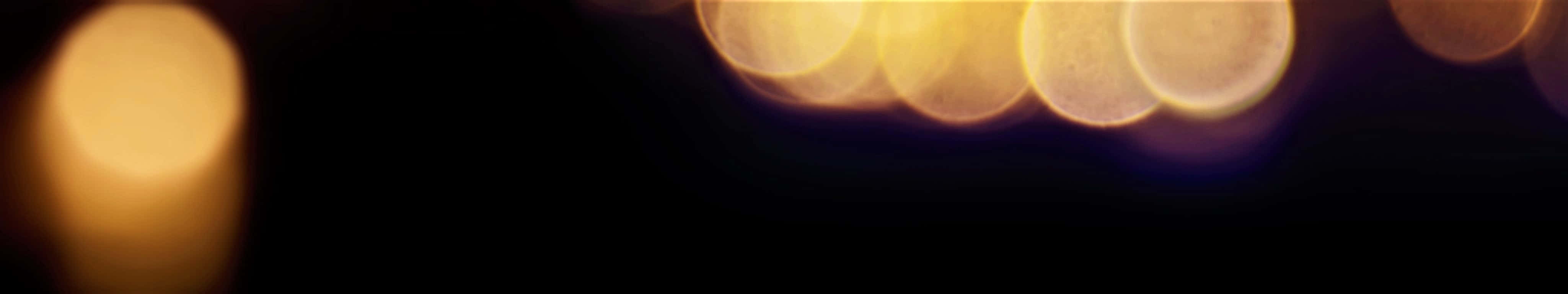 golden circular bokeh lights, deep black background, warm dreamy ambiance, 4K Desktop Wallpaper