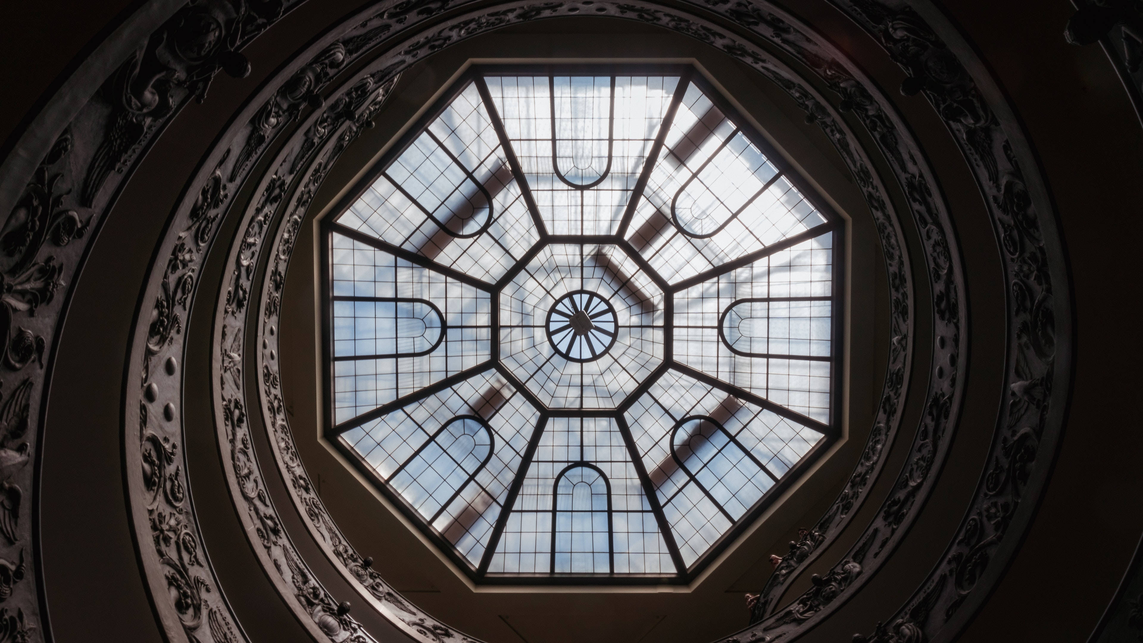 octagonal glass ceiling, leaded glass patterns, dark carved architectural details, 4K Desktop Wallpaper