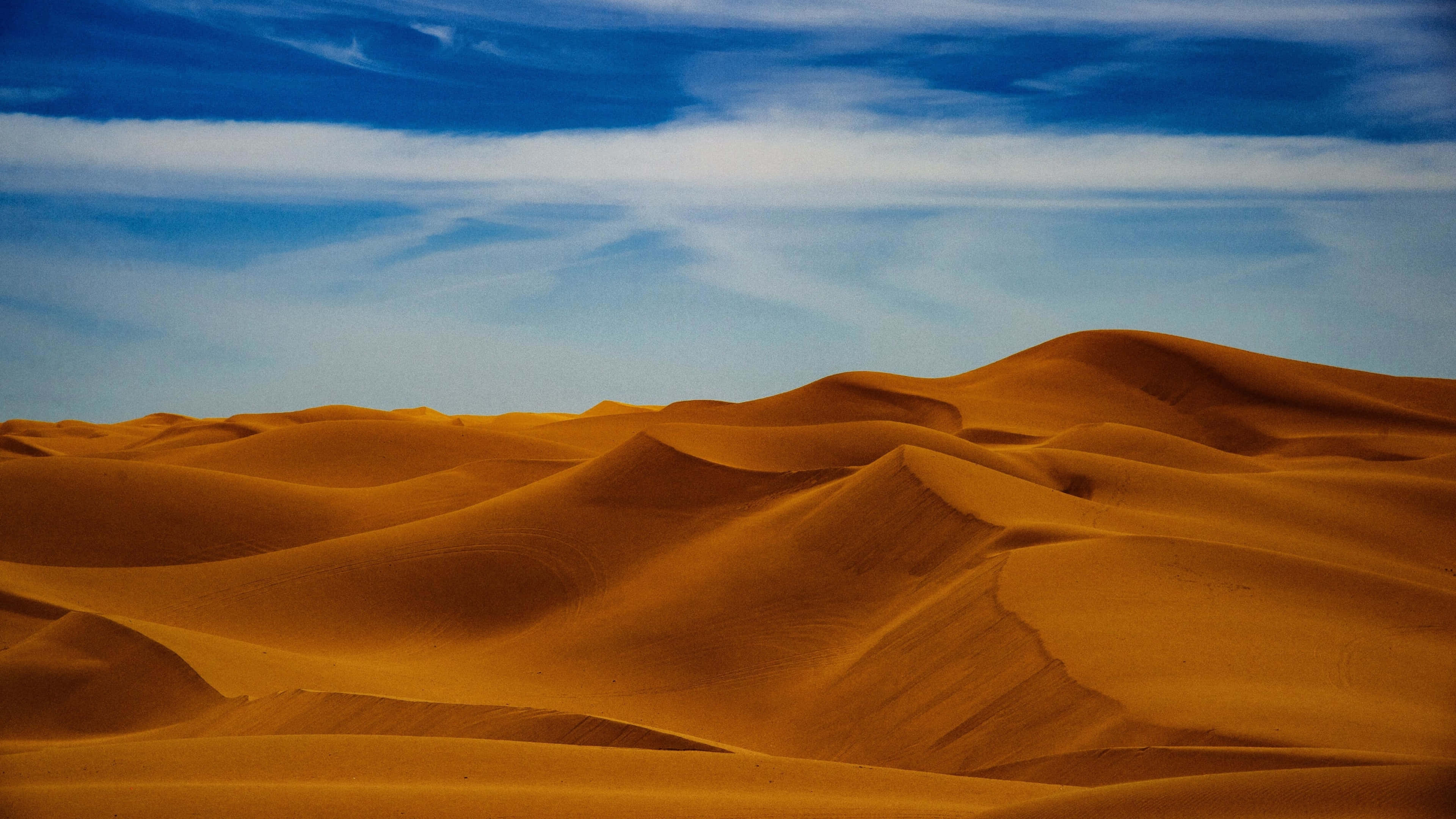 4K Desert, golden sand dunes, vibrant blue sky, 4K Desktop Wallpaper