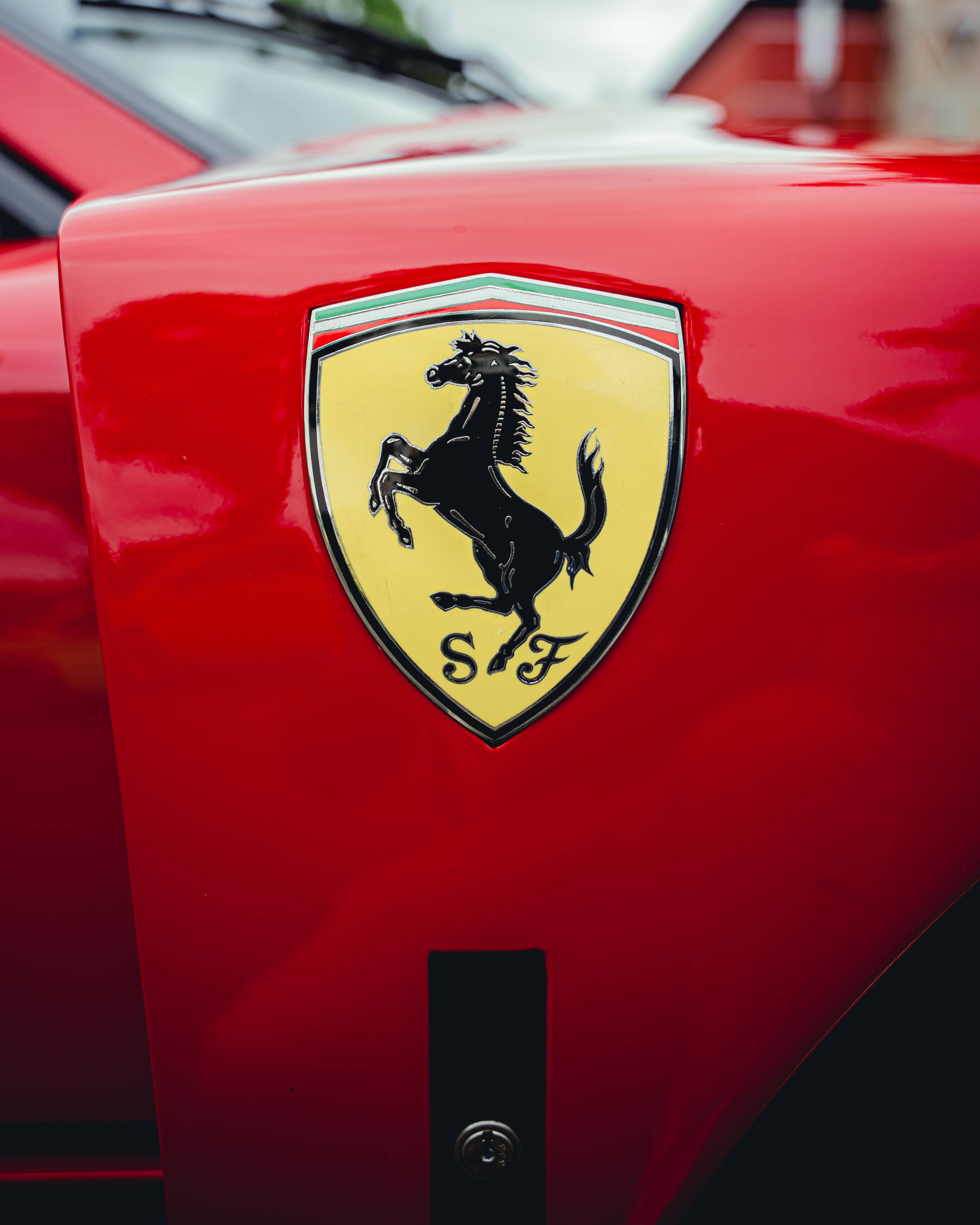 Ferrari emblem, glossy red car hood, black horse, 4K Phone Wallpaper