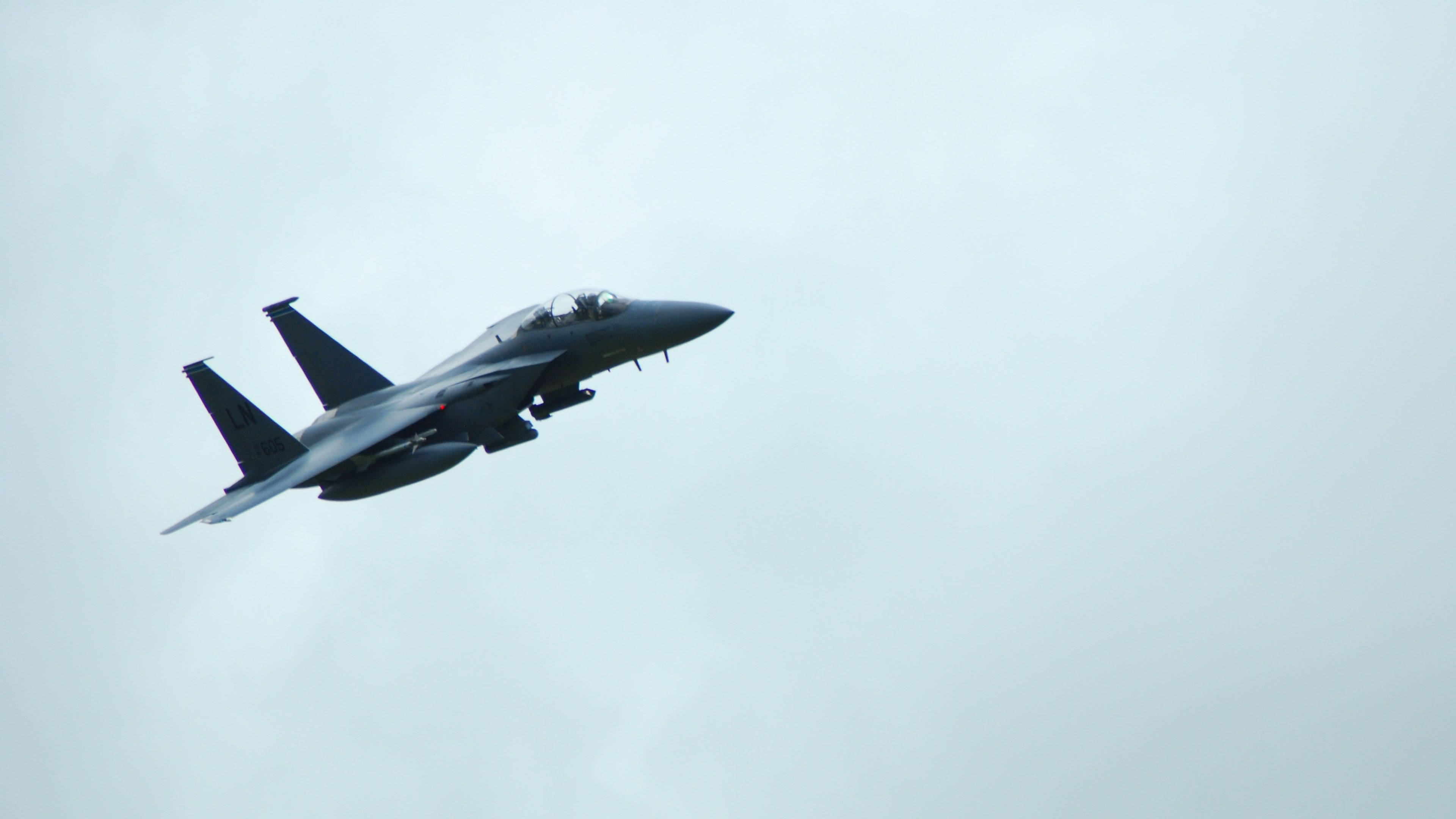 4K Fighter Plane, sleek gray fighter jet, overcast sky, 4K Desktop Wallpaper