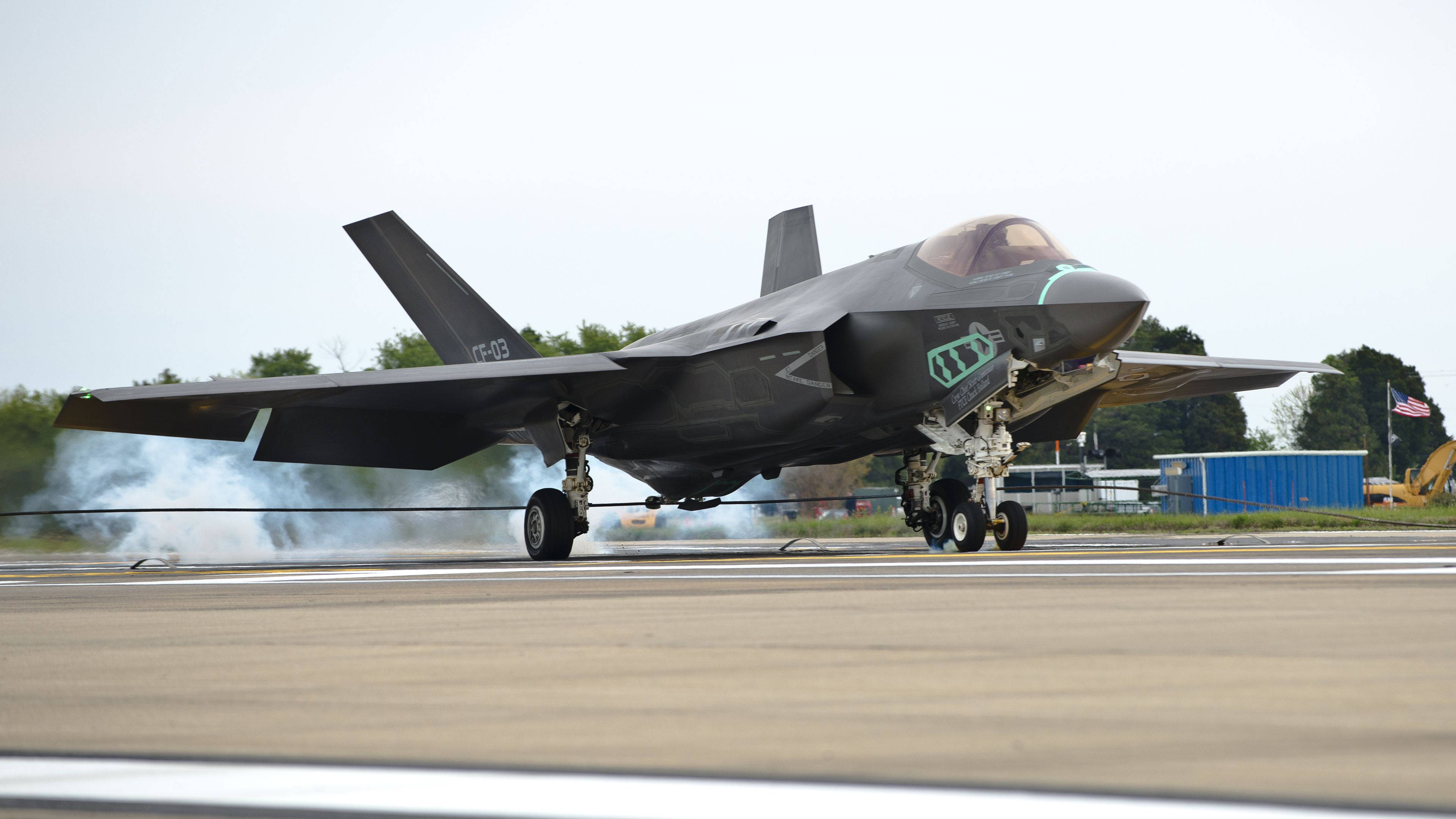 F-35, sleek black, runway, 4K Desktop Wallpaper