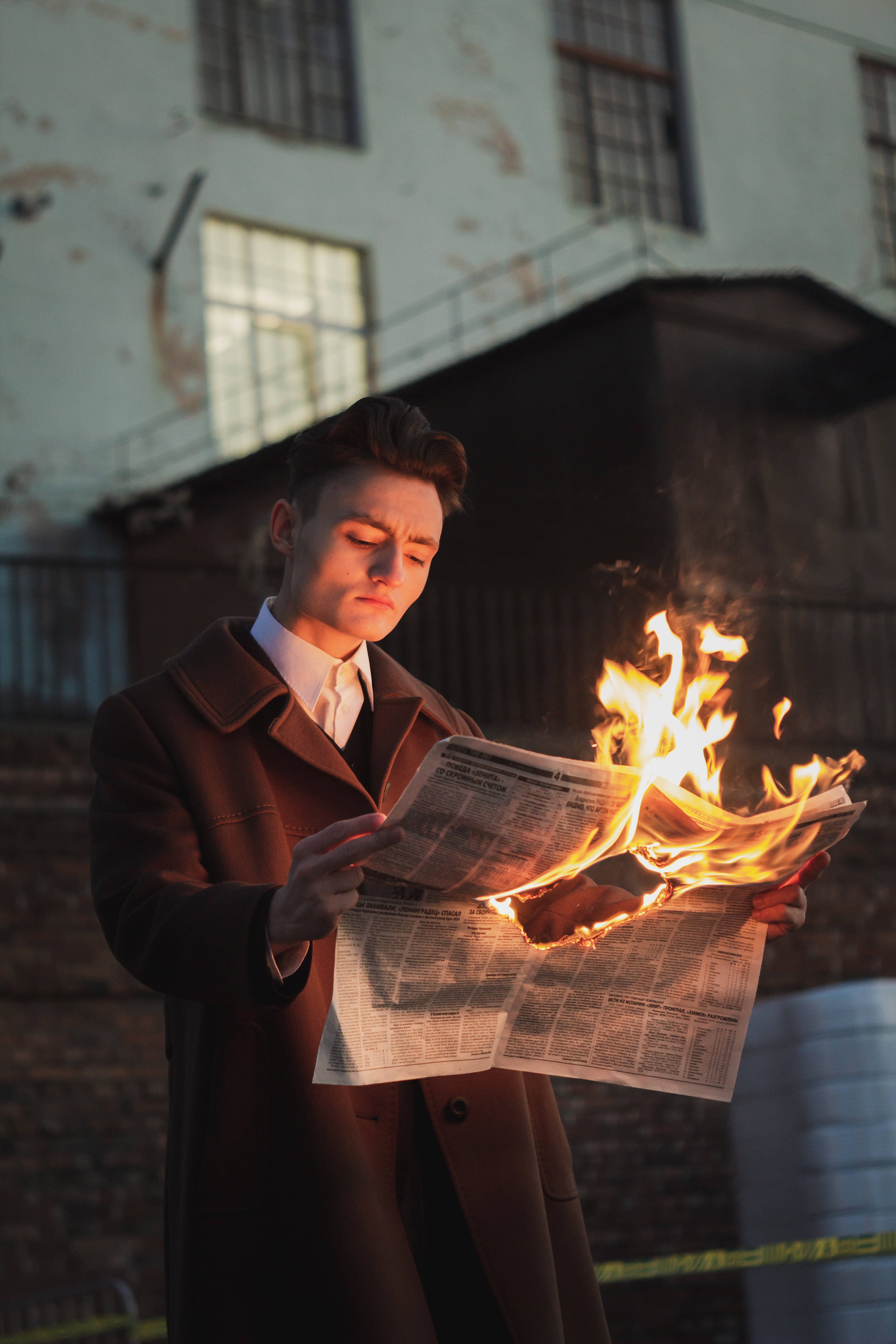 newspaper, brown coat, gritty urban backdrop, 5K Phone Wallpaper
