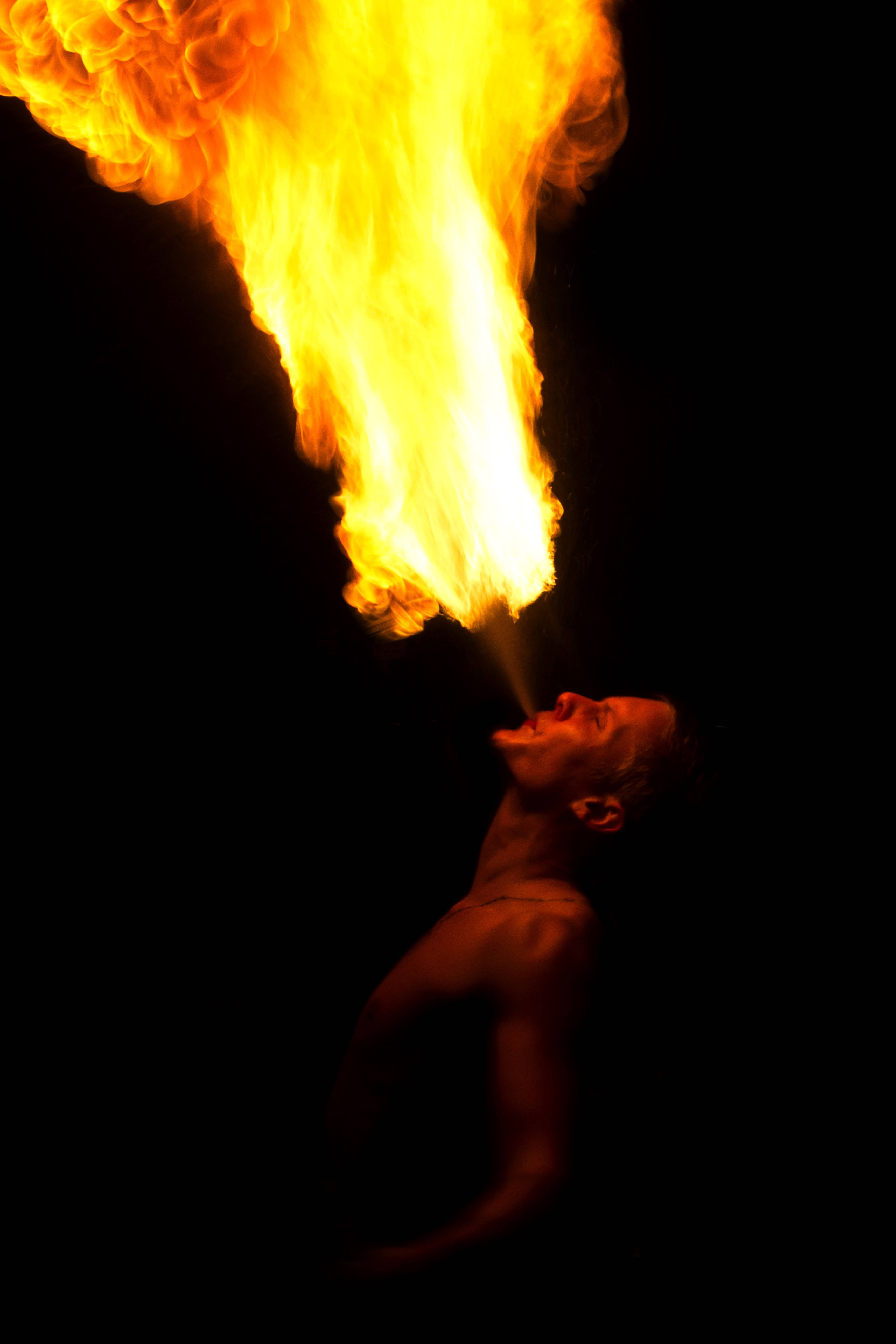 man, golden flame, pitch black background, 5K Phone Wallpaper