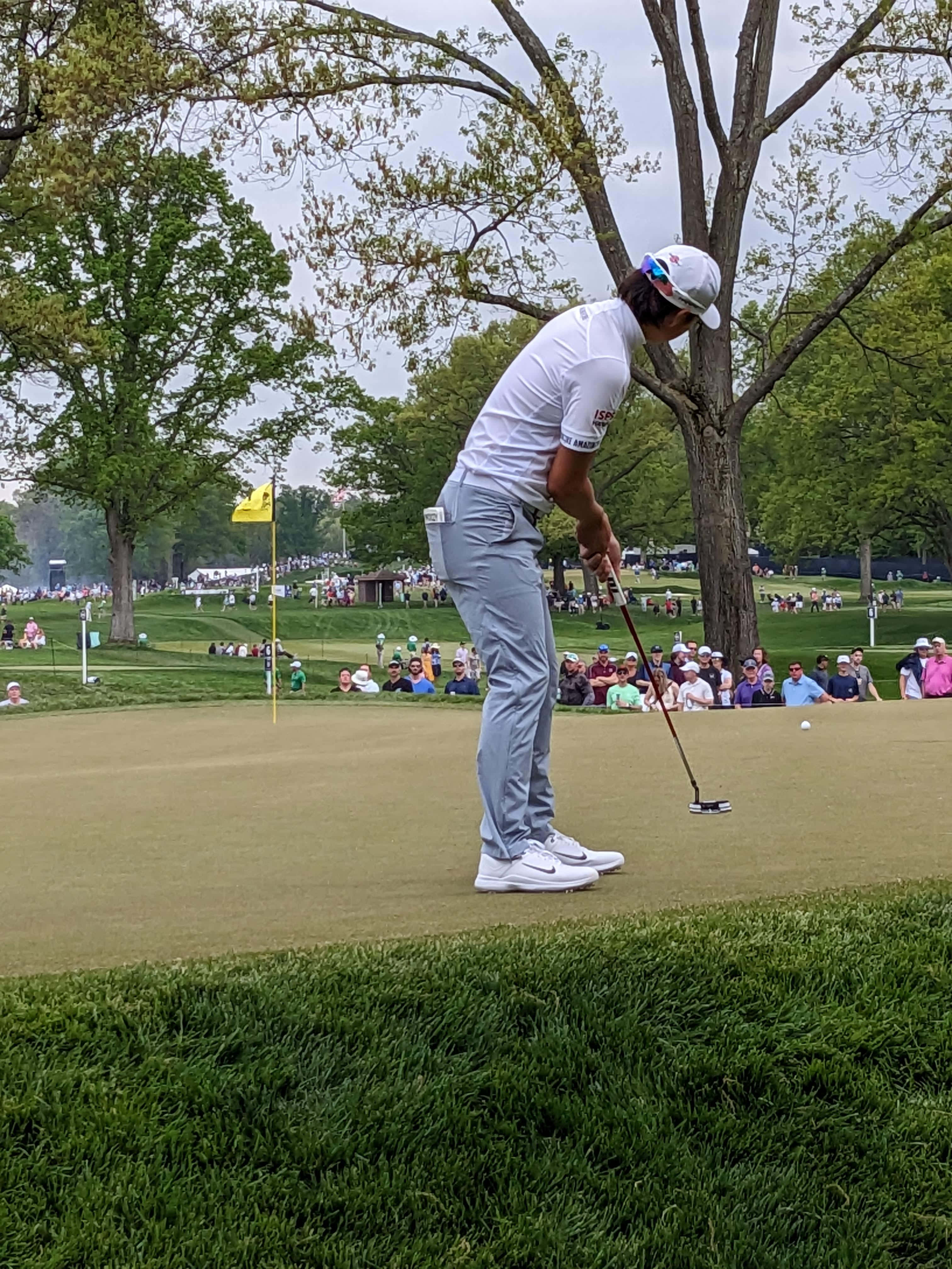 golfer, white attire, putting green, 4K Phone Wallpaper