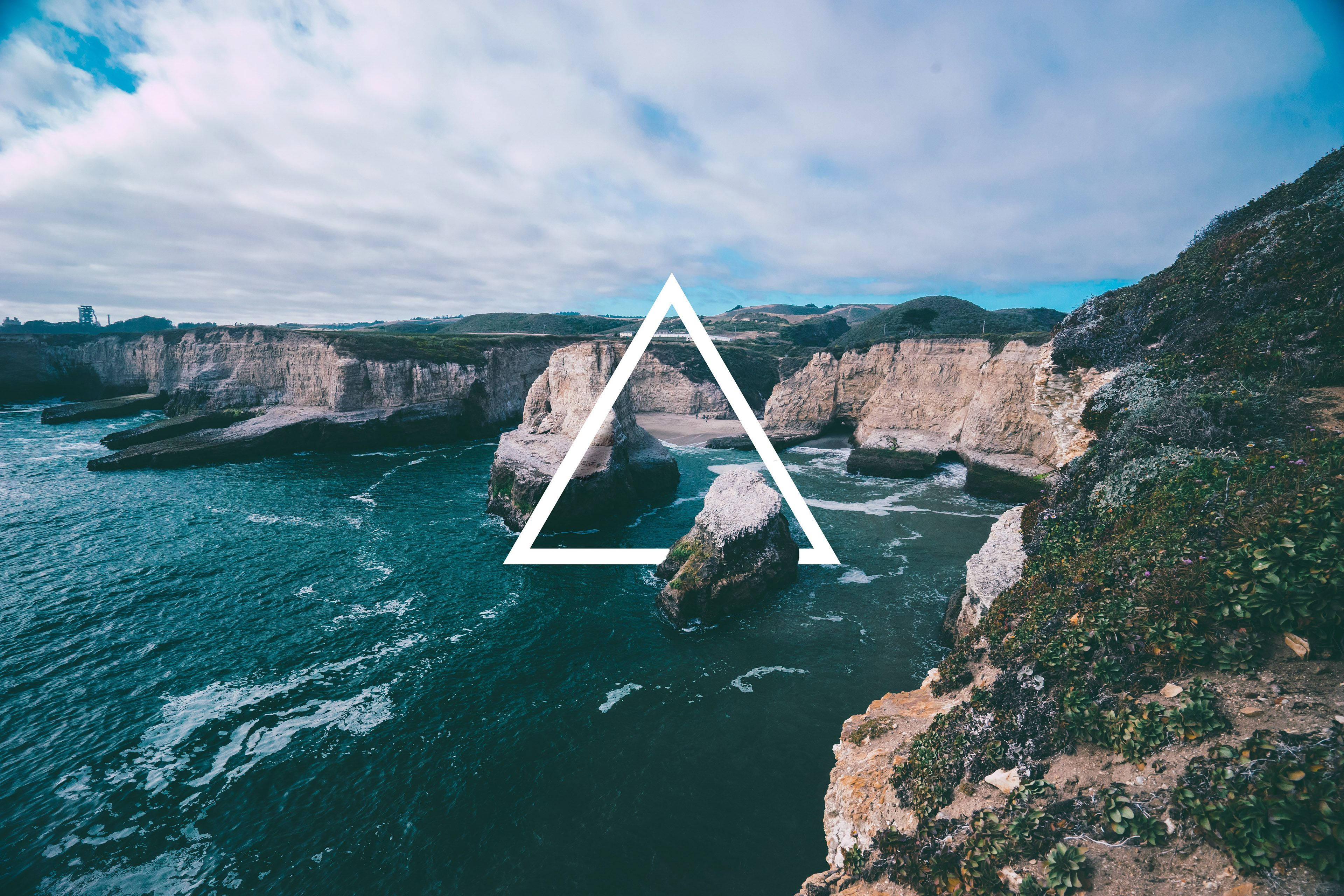 white triangle, coastal cliffs, deep teal waters, 4K Desktop Wallpaper