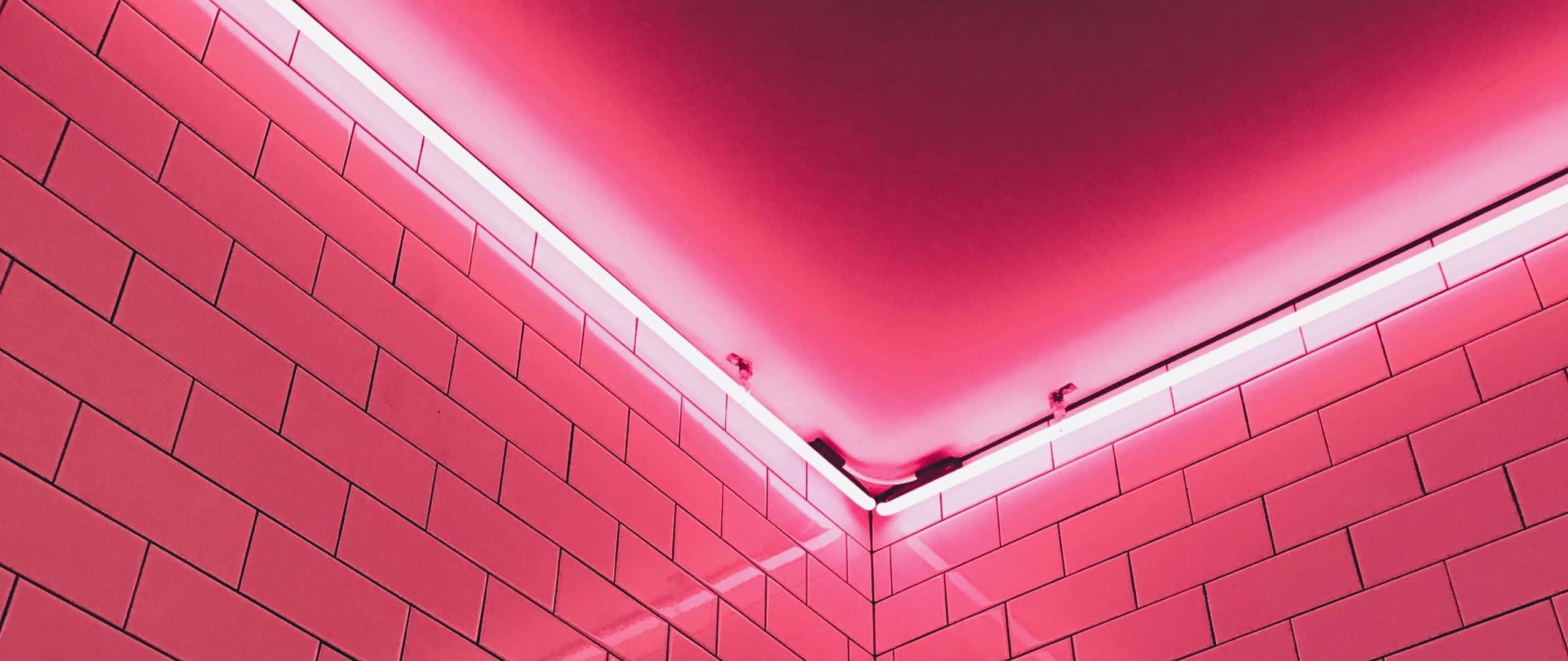 red aesthetic laptop, bricks wall, vibrant pink neon lights, 2K Desktop Wallpaper