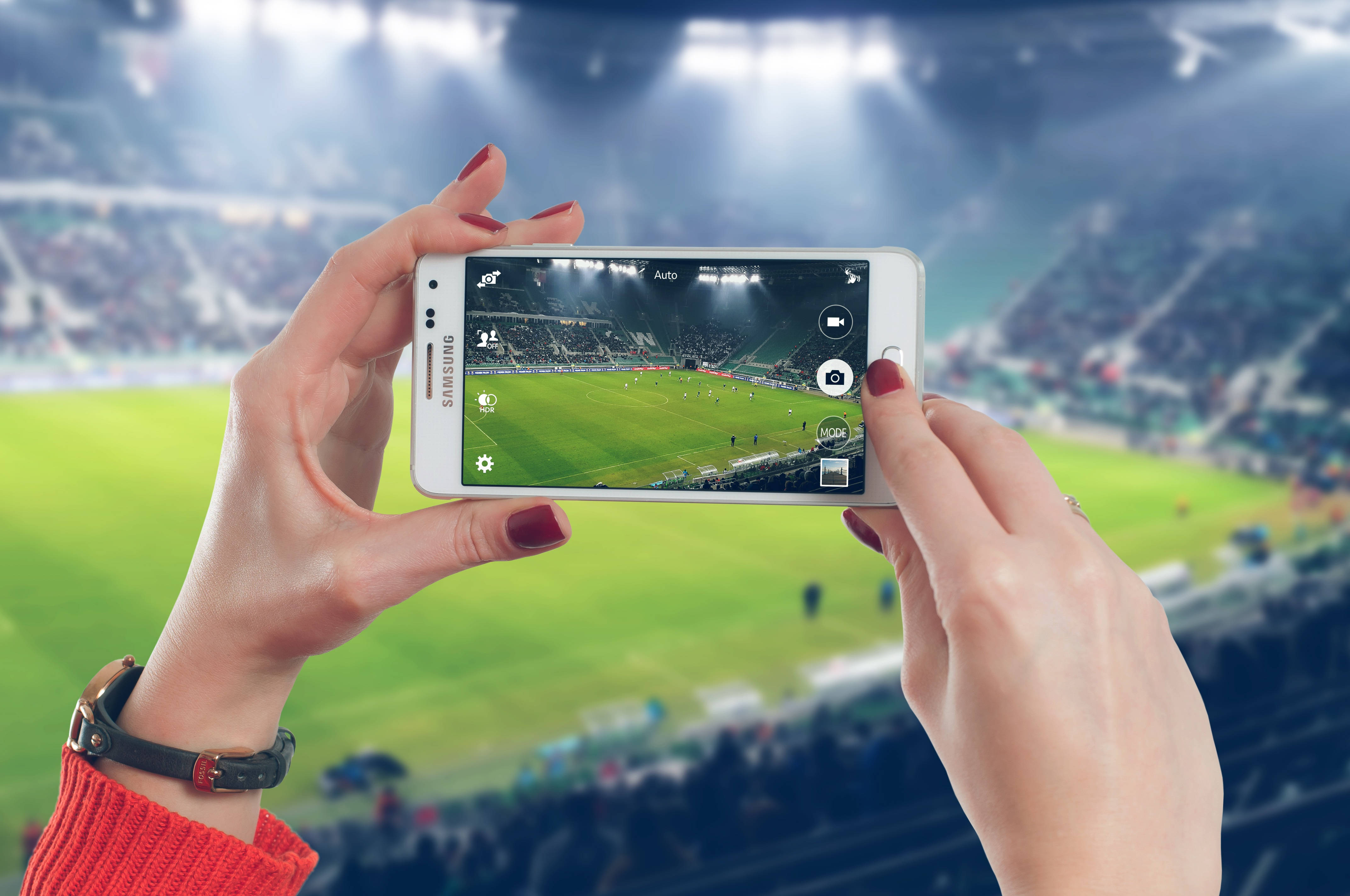 sleek modern smartphone, marble table, vibrant soccer match, 4K Desktop Wallpaper