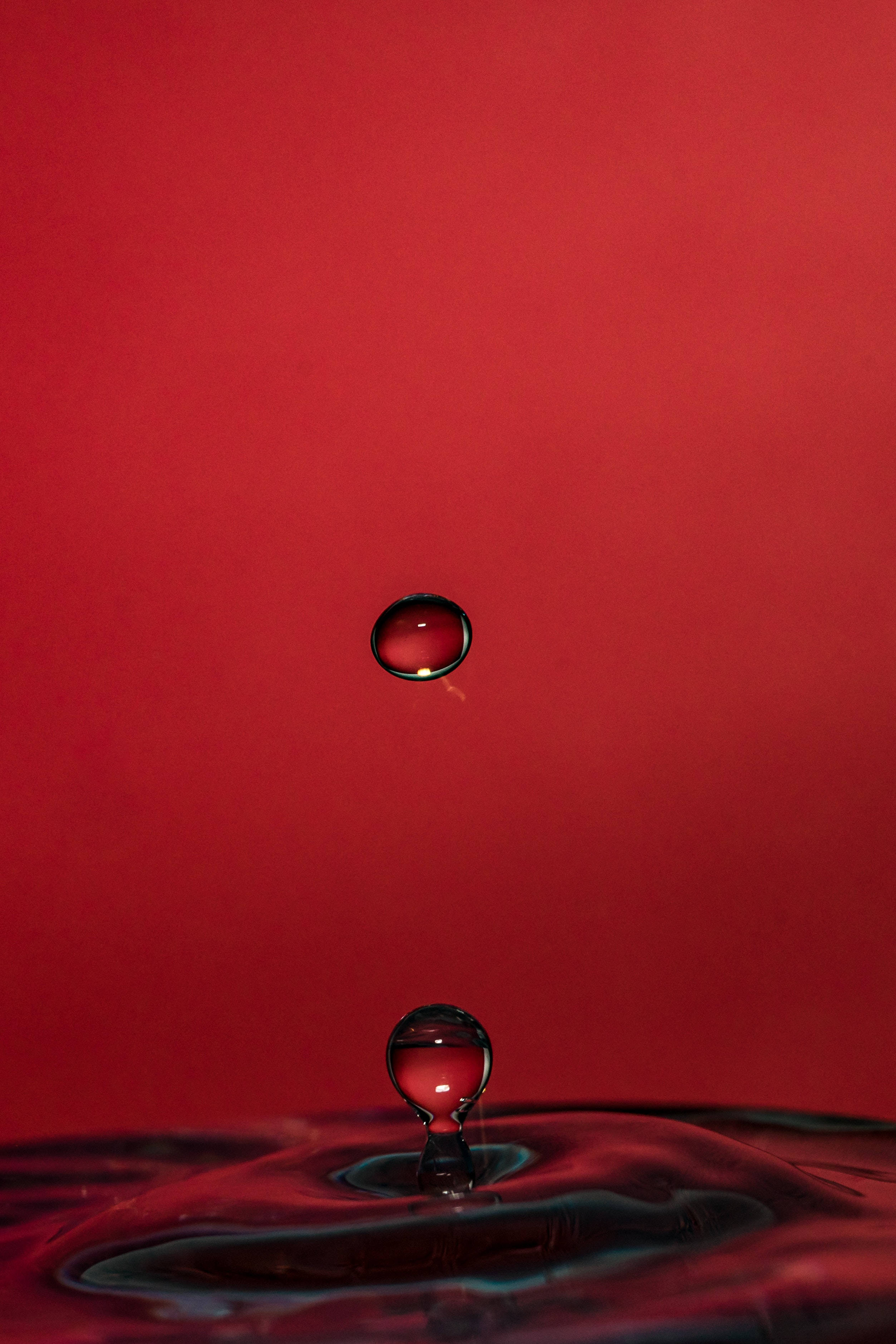 4K iPhone, red liquid, suspended water droplet, 2K Phone Wallpaper