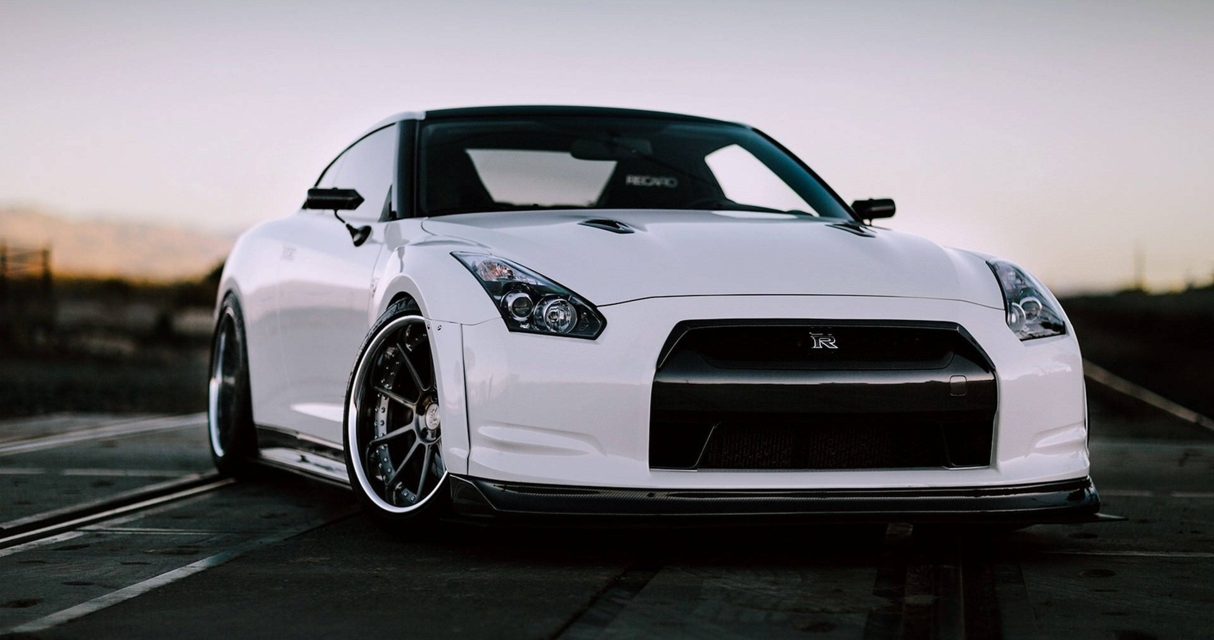 white Nissan GT-R, black rims, paved road, 4K Desktop Wallpaper
