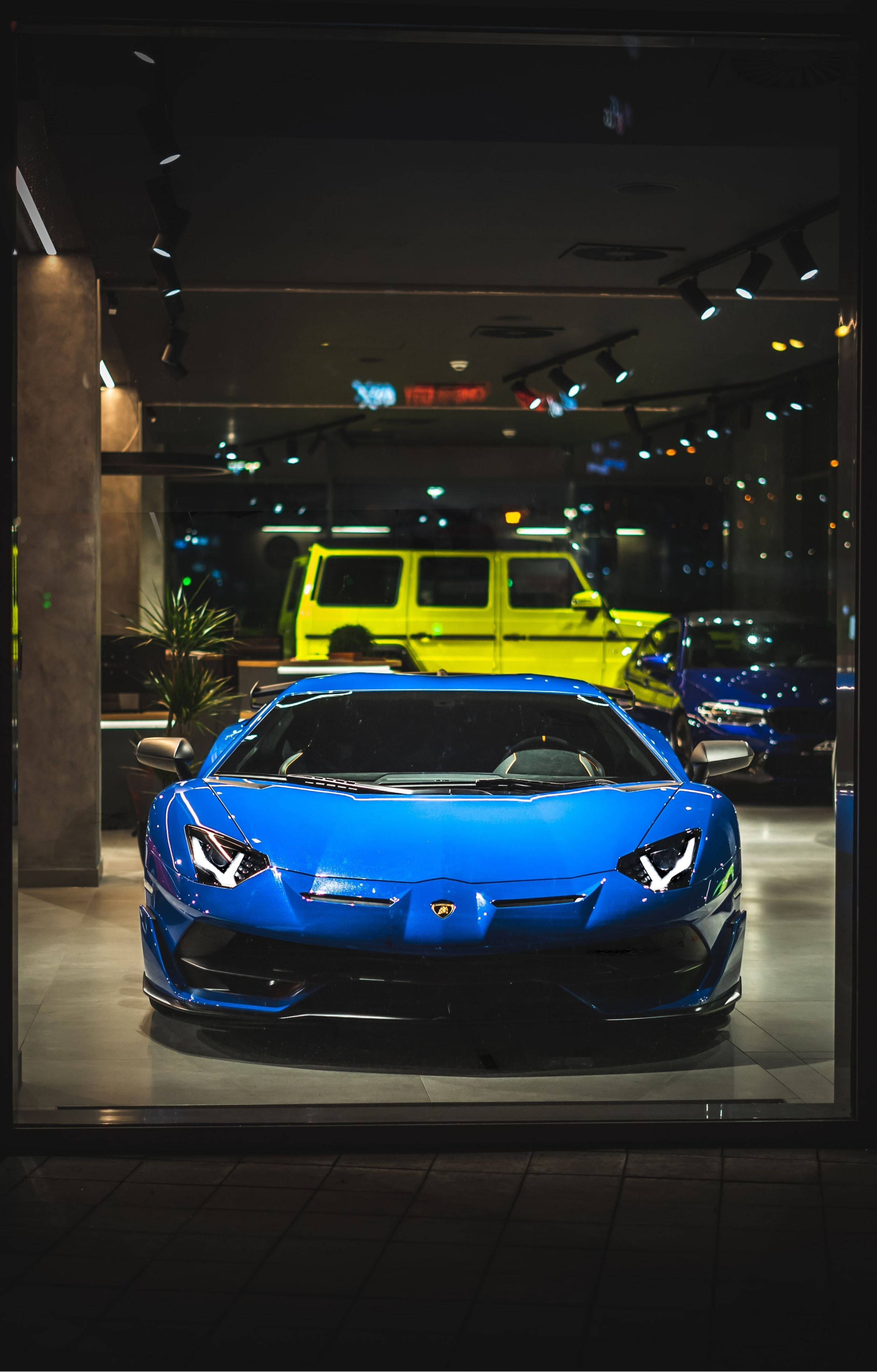 Lamborghini, vibrant blue, showroom lights, 4K Phone Wallpaper