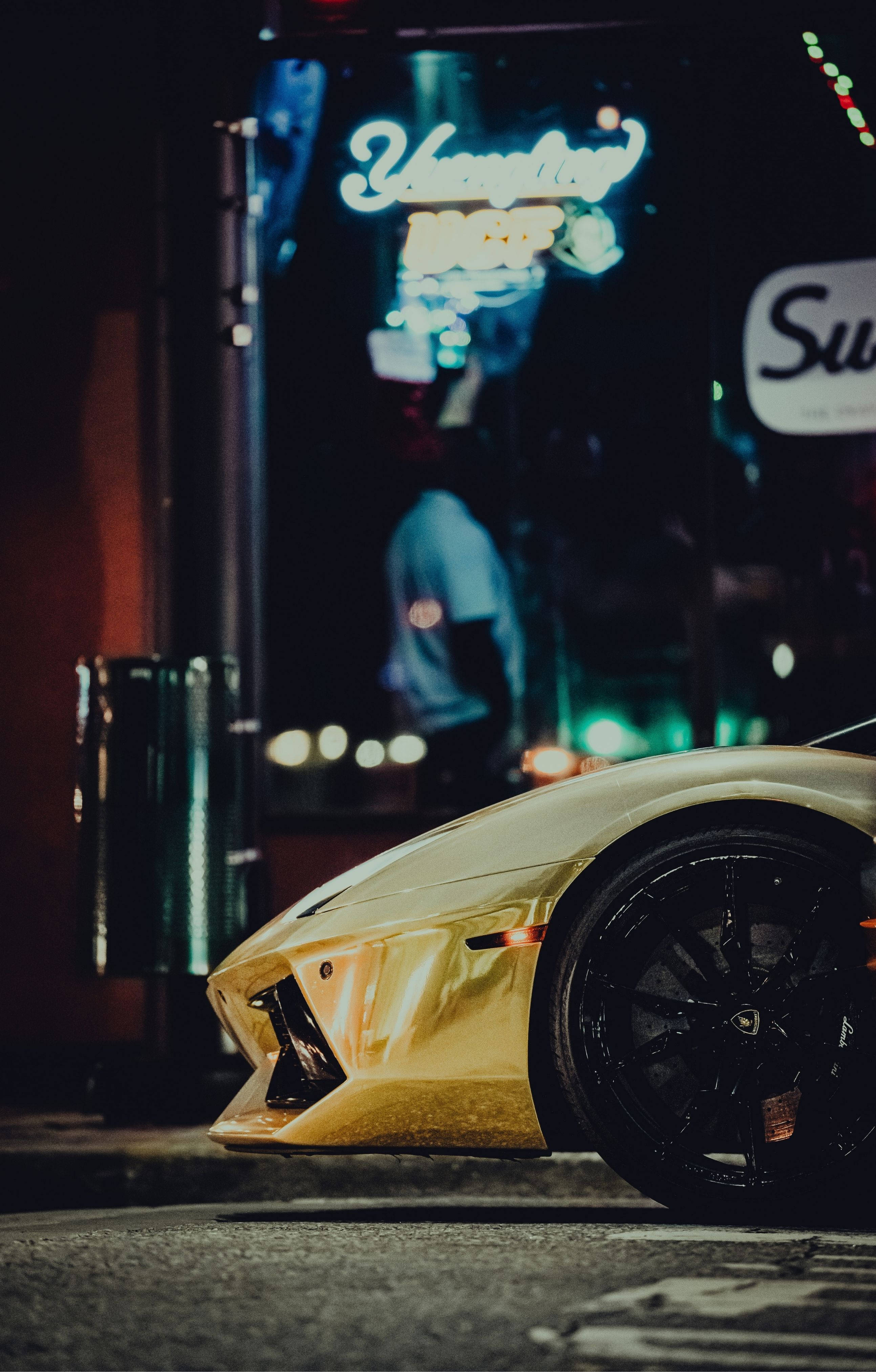 4K Lamborghini iPhone, gold sports car, wet city street, 4K Phone Wallpaper