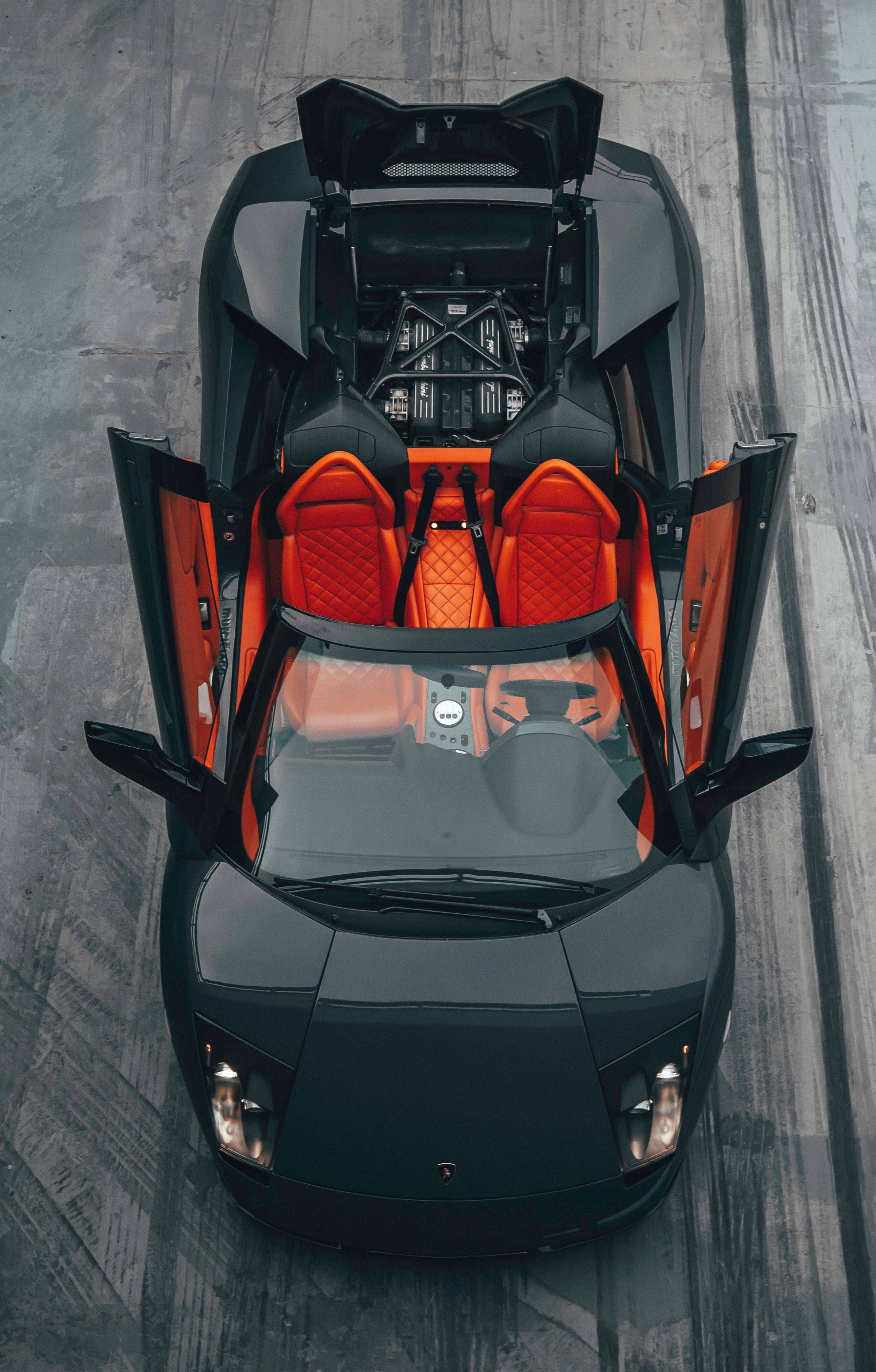 Lamborghini, black, vibrant orange quilted seats, 4K Phone Wallpaper