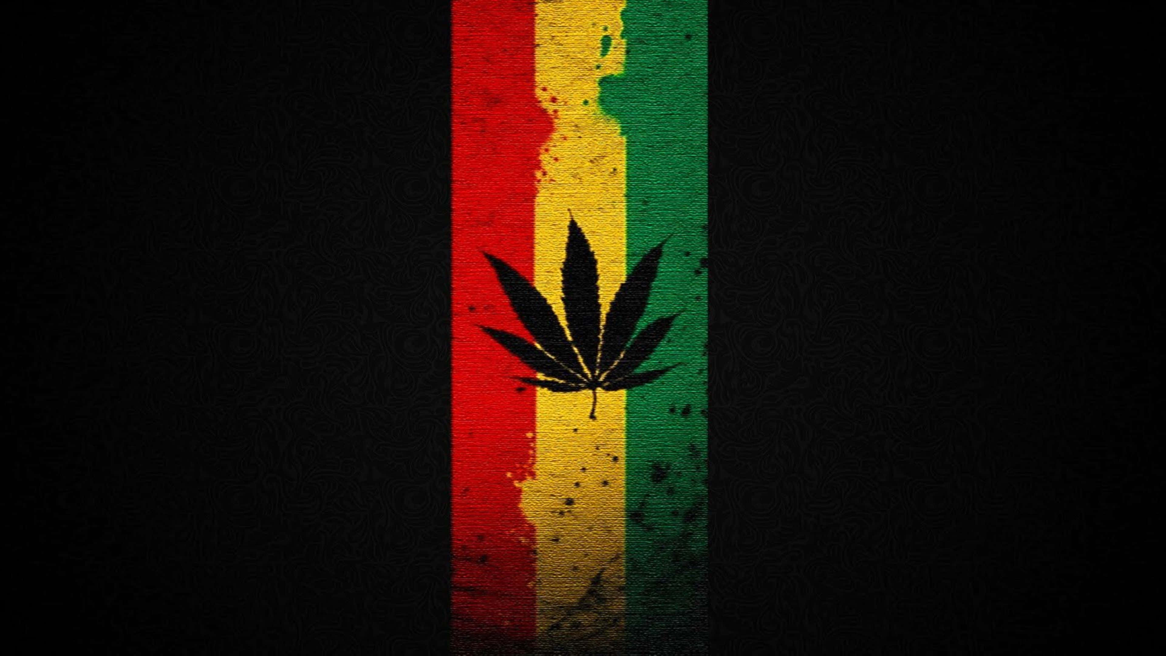 cannabis leaf silhouette, distressed red yellow and green vertical stripe, dark textured background, 4K Desktop Wallpaper