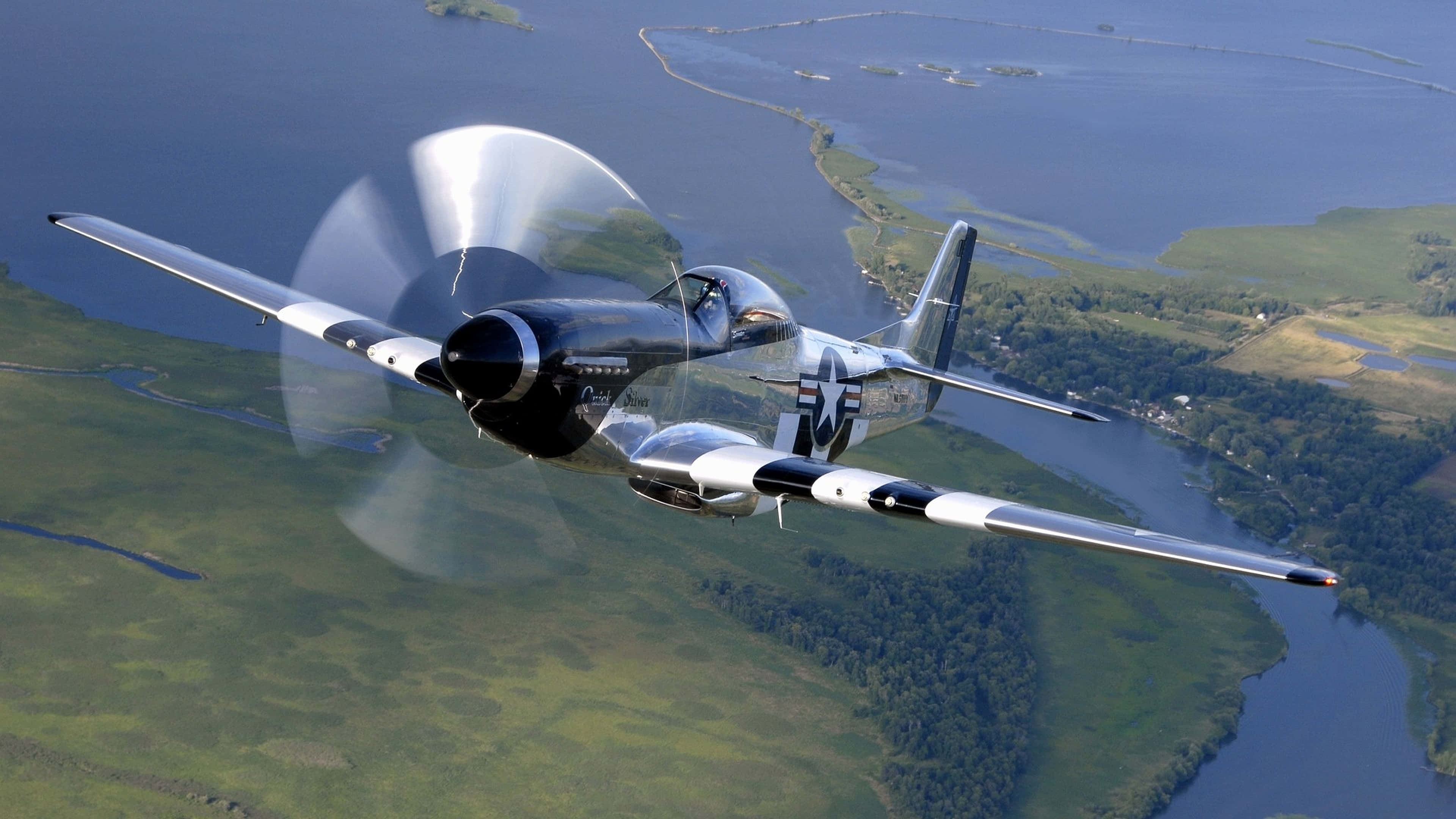 vintage military fighter plane, winding river, lush green landscape, 4K Desktop Wallpaper