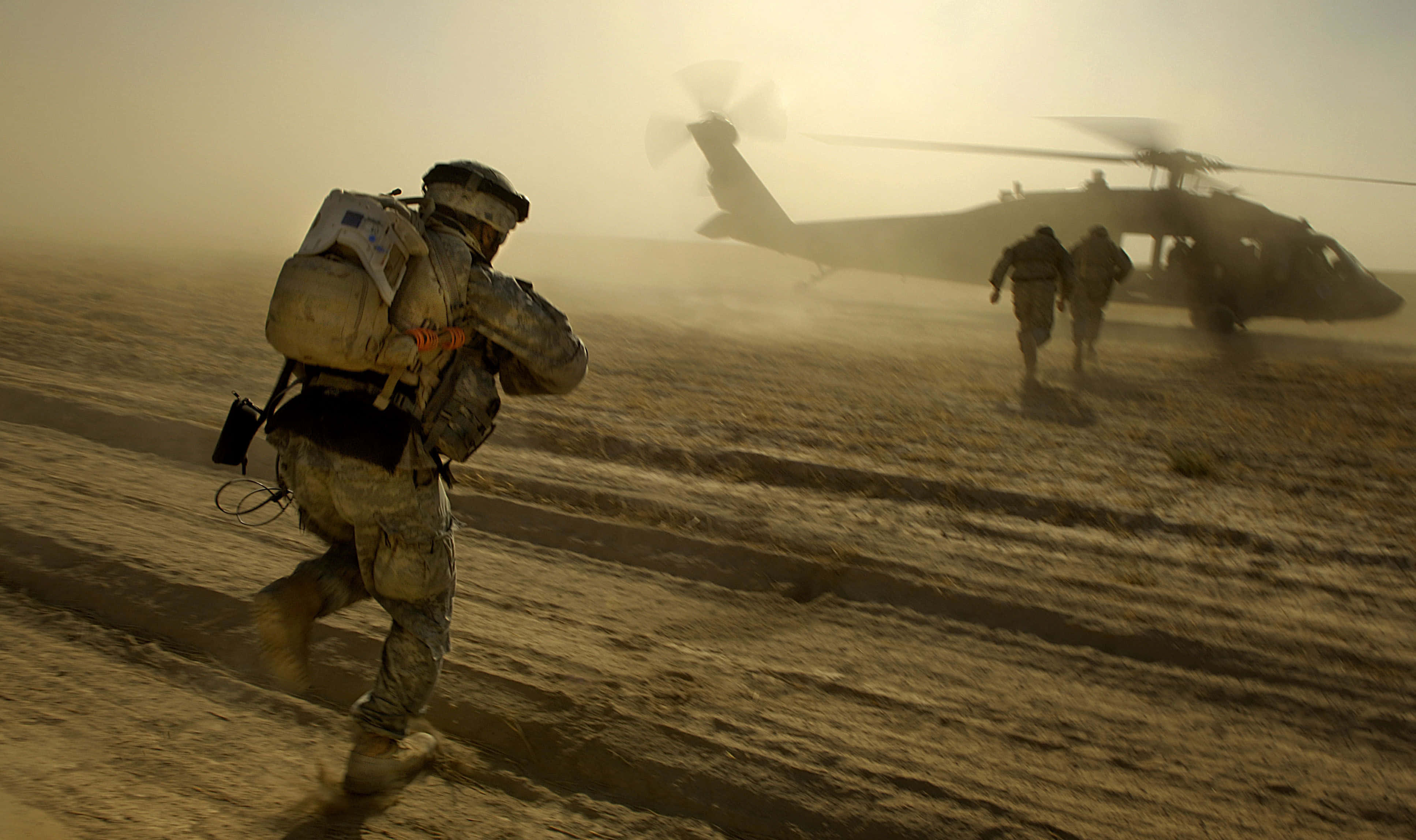 dusty desert plain, hovering military helicopter, golden hour, 4K Desktop Wallpaper