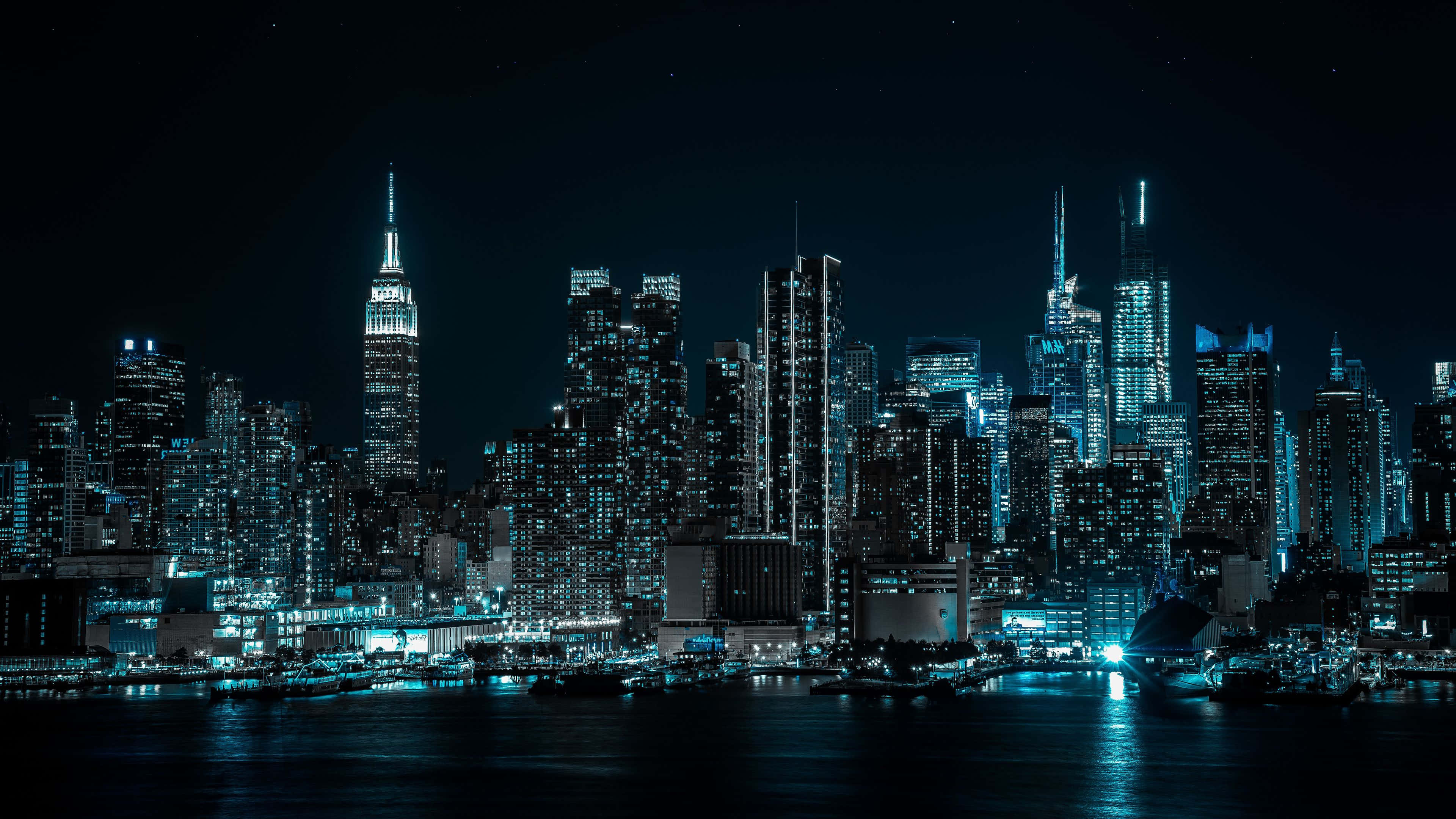New York City, nighttime cityscape, glowing skyscrapers, 4K Desktop Wallpaper