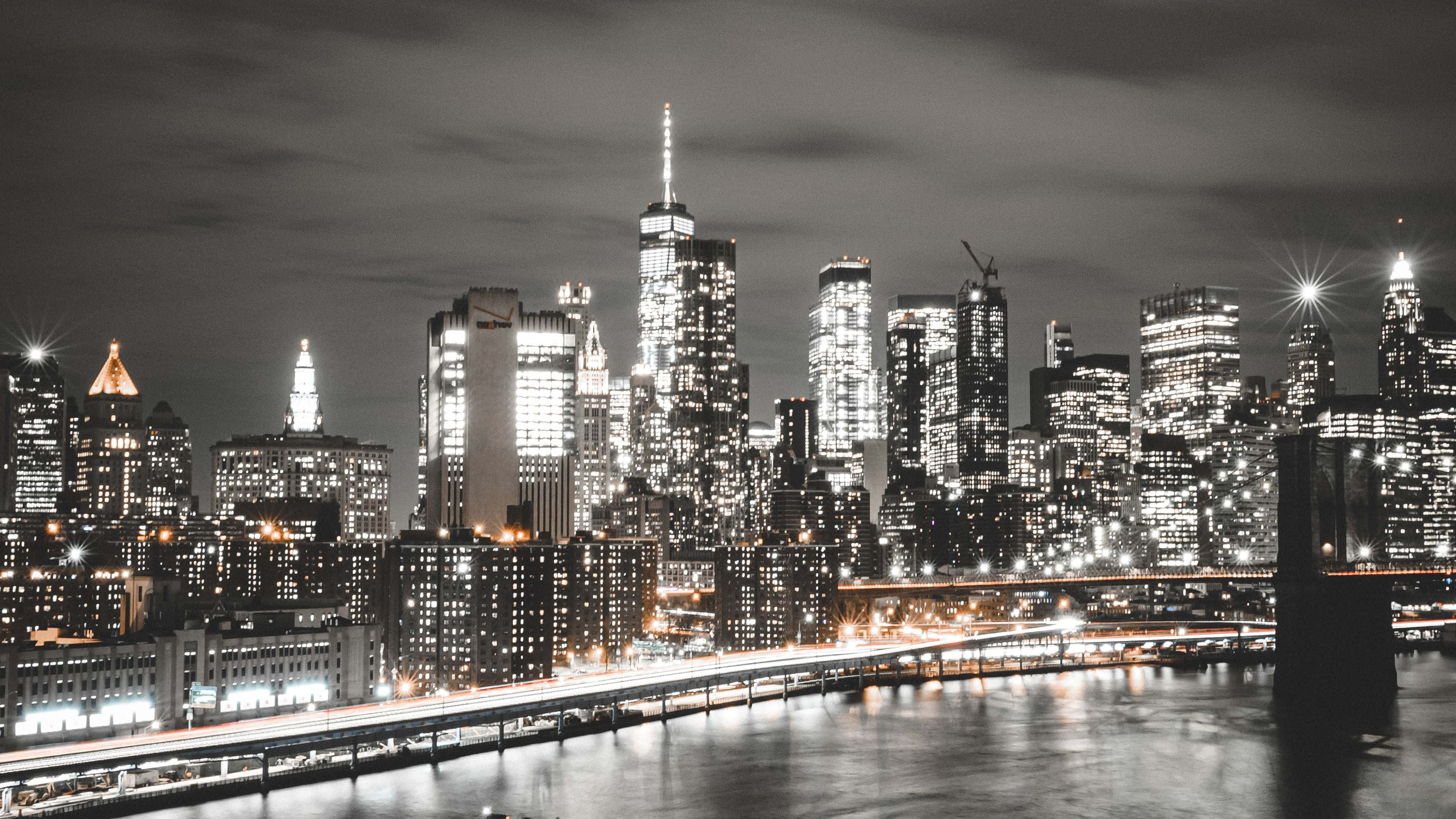 New York, nighttime cityscape, glowing skyscrapers, 4K Desktop Wallpaper