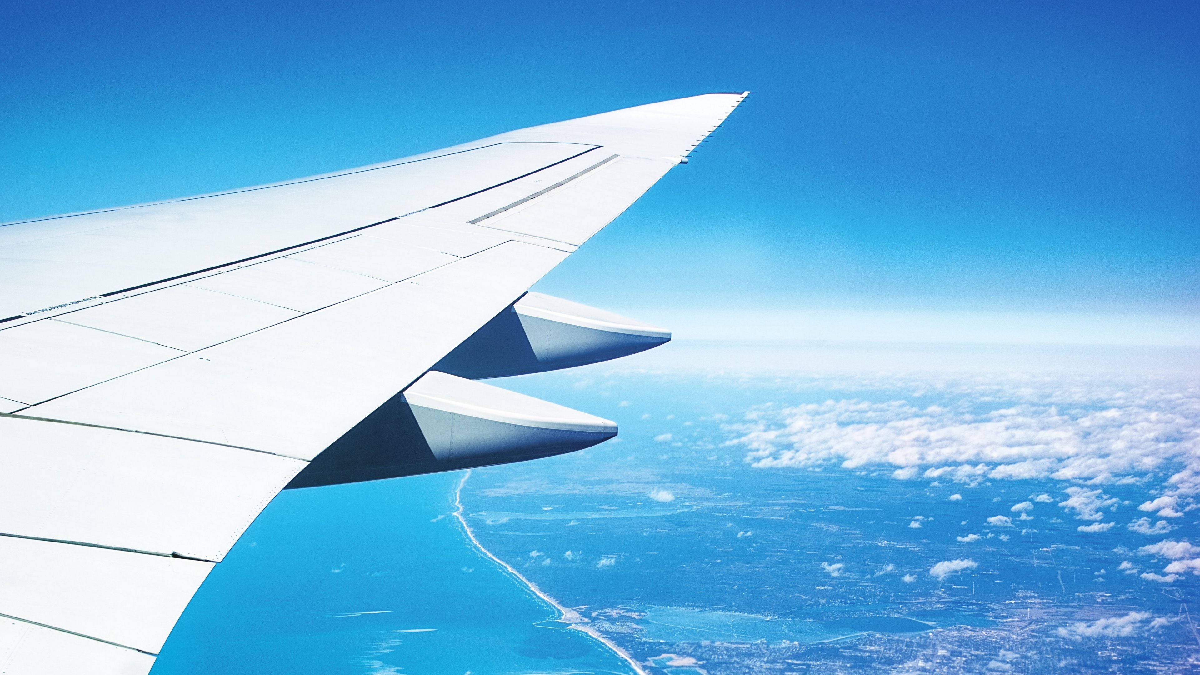 4K Plane, Aircraft wing, turquoise ocean, 4K Desktop Wallpaper