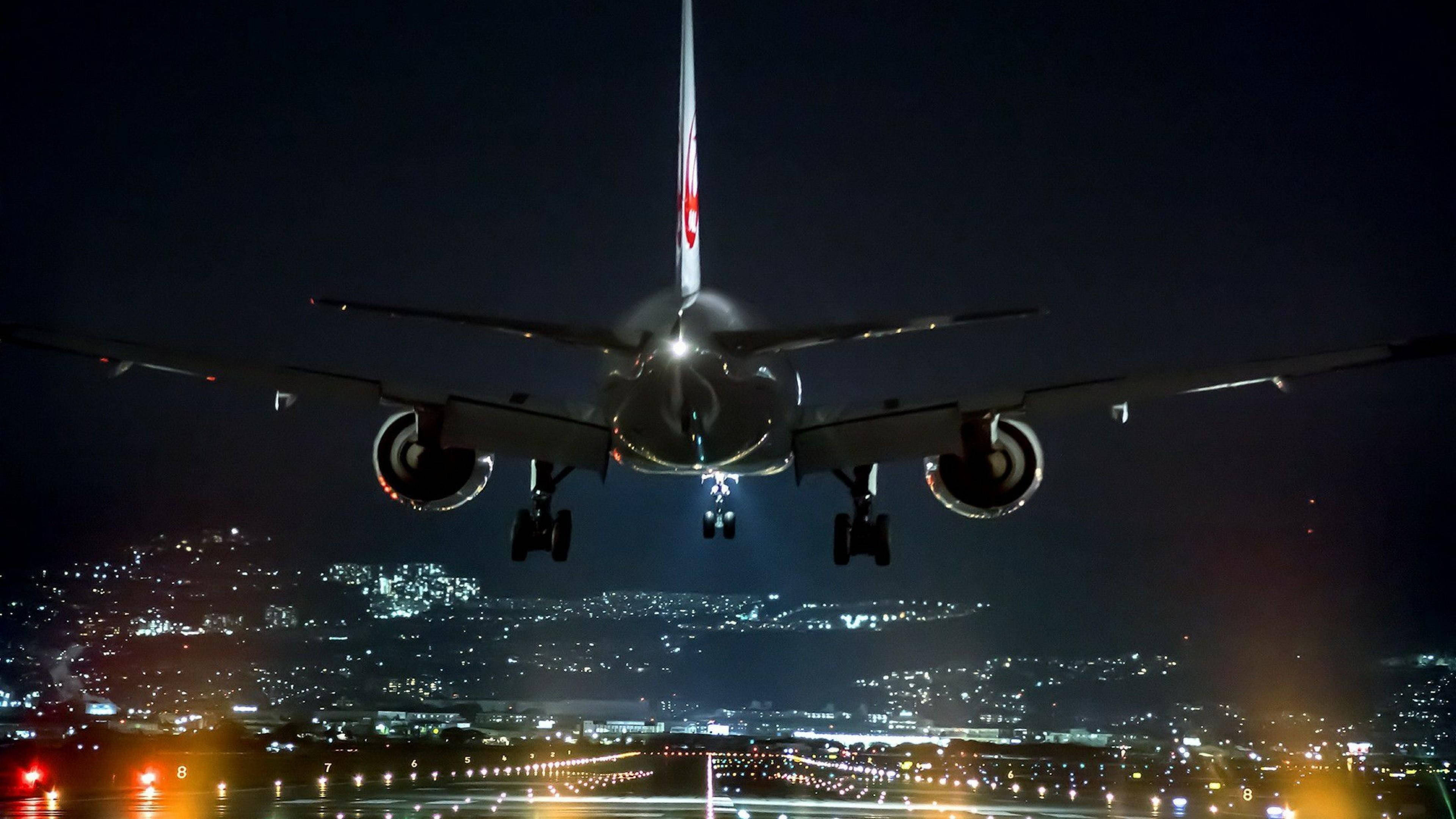 black airplane, night, landing lights, 4K Desktop Wallpaper