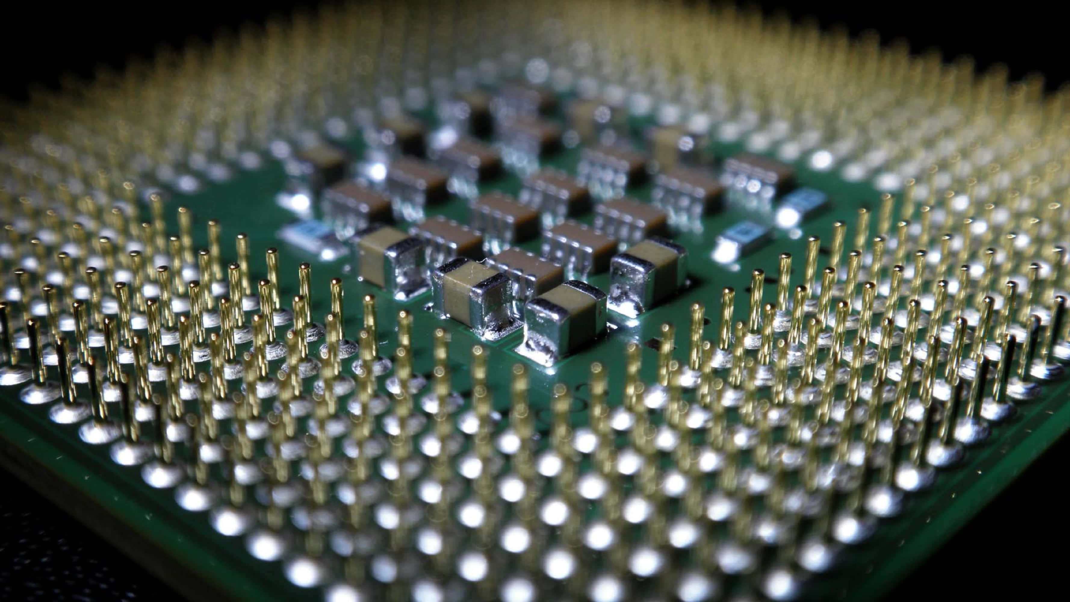 4K Processor, green circuit board, golden pins, 2K Desktop Wallpaper